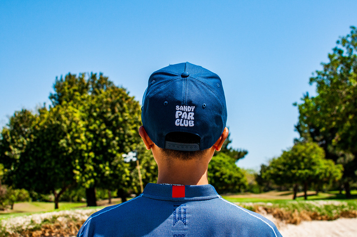 Sandy Par Club logo transposed on to a hat.