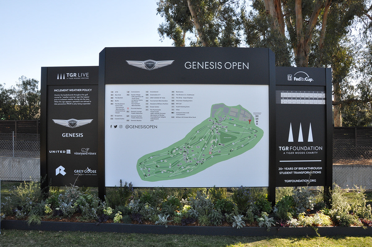 A large printed entrance sign featuring a large course map that can be seen as viewers walk into The Genesis Invitational golf event.