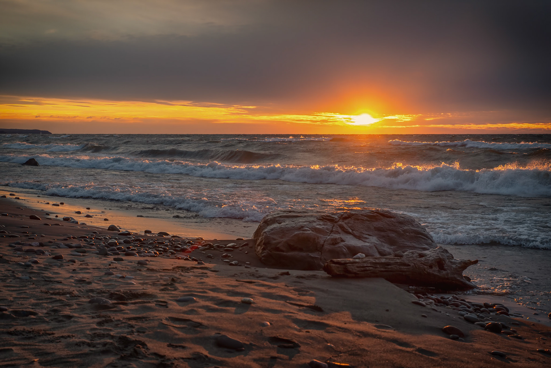 A Brief Sunset Amongst Clouds and Waves: Sometimes waiting that extra time is worth it, when the sun peaks through the clouds just right.