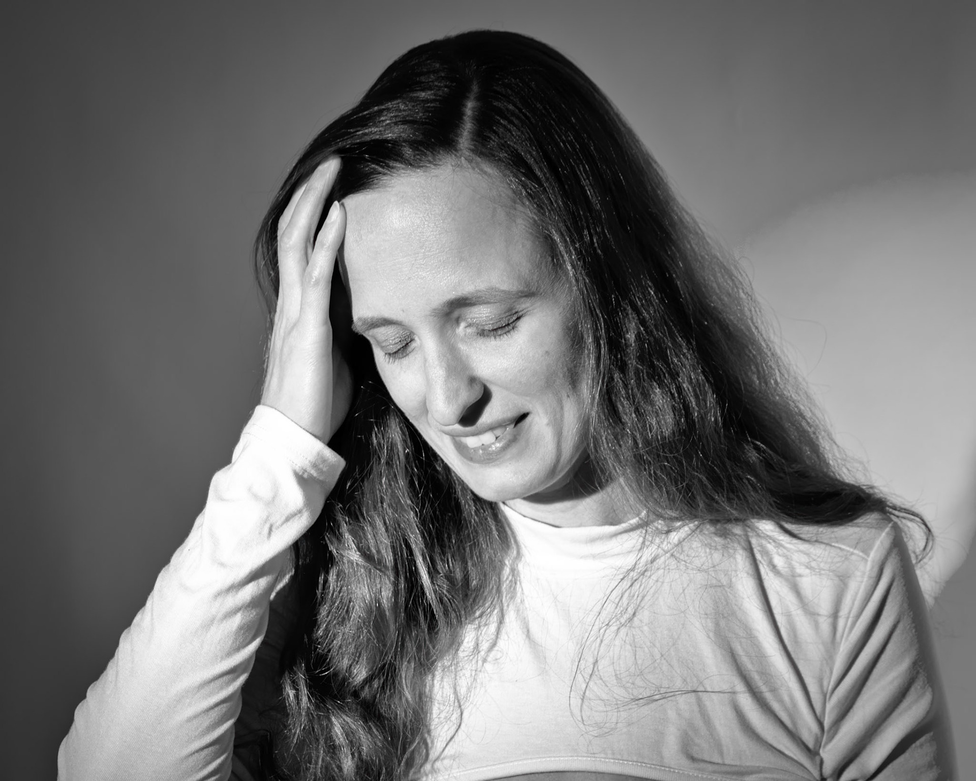Super Heroine - Concentration (B&amp;W): Trying out a basic superheroine costume. Godox v1 w/ snoot for face, v1 w/ 30x120cm for general, and AD200 w/ red gel for backdrop.