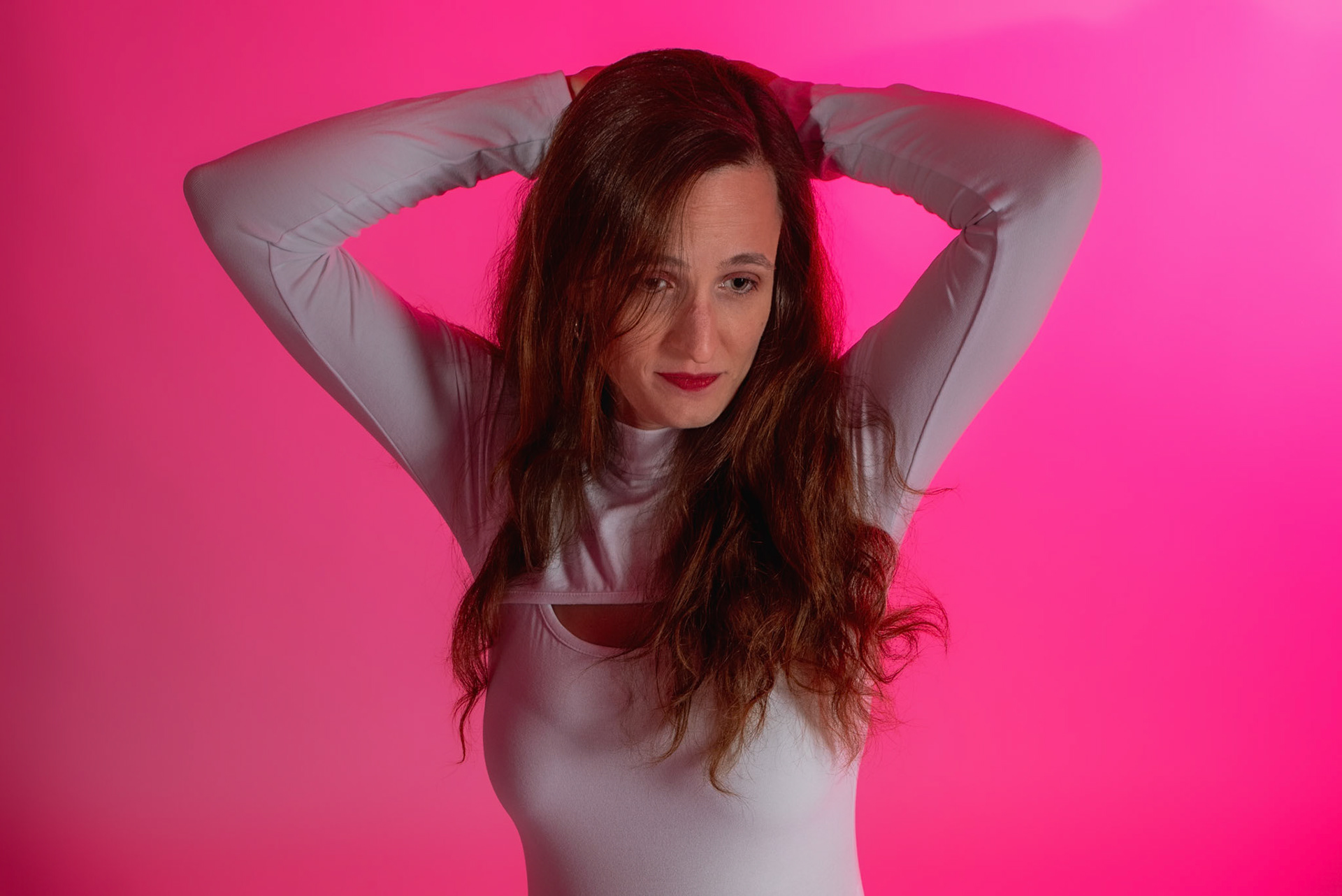 Super Heroine - Defiant Surrender: Trying out a basic superheroine costume. Godox v1 w/ snoot for face, v1 w/ 30x120cm for general, and AD200 w/ red gel for backdrop.