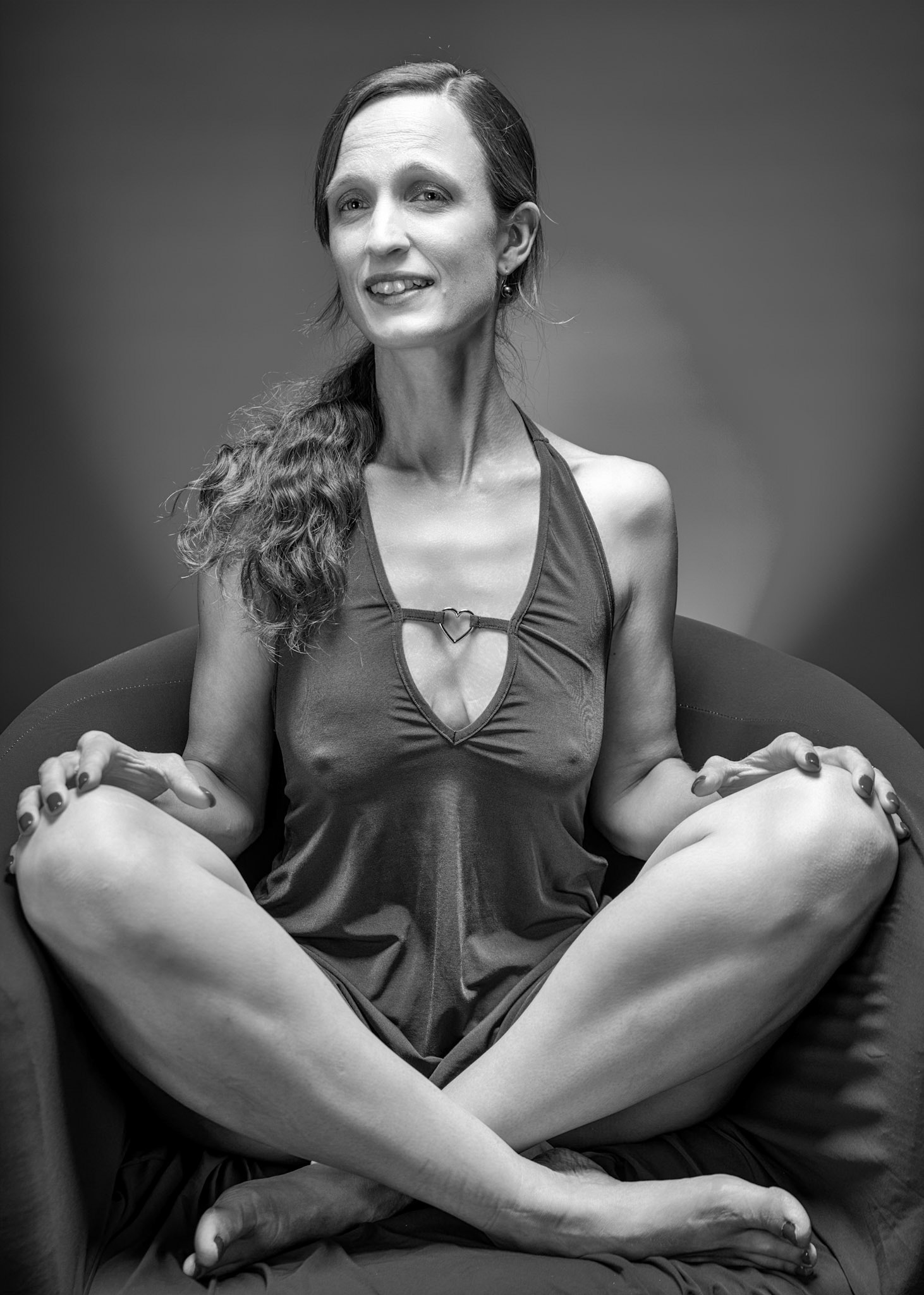 Little Teal Dress - Cross-Legged (B&amp;W): Taking advantage of rain, we setup a new backdrop from Prime week and some new dresses. Godox V1 above and on backdrop (with red gel). Godox AD200 front left and front right for fill light in 120x30 softboxes.