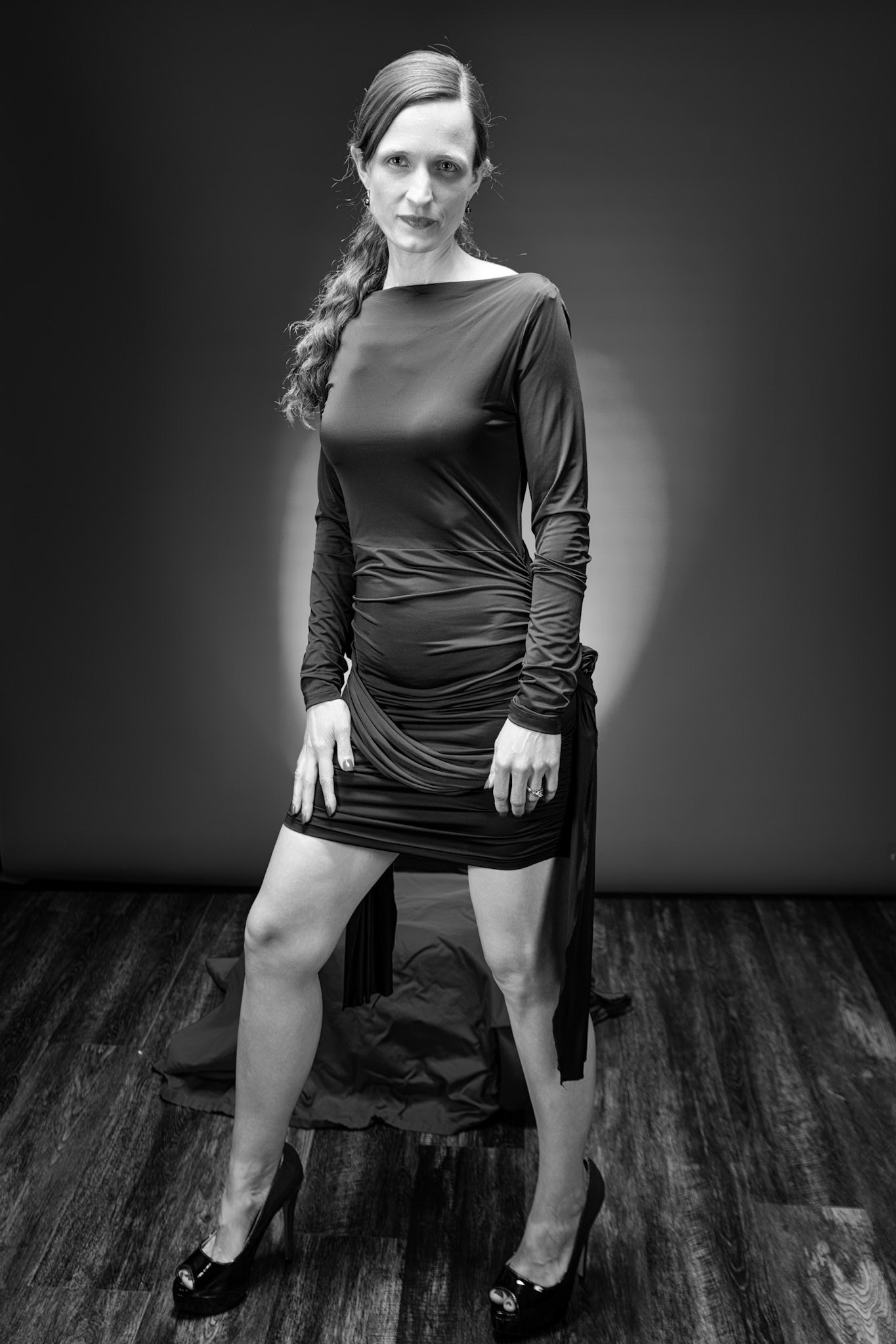 Little Black Dress - Staredown (B&amp;W): Taking advantage of rain, we setup a new backdrop from Prime week and some new dresses. Godox V1 above and on backdrop (with red gel). Godox AD200 front left and front right for fill light in 120x30 softboxes.