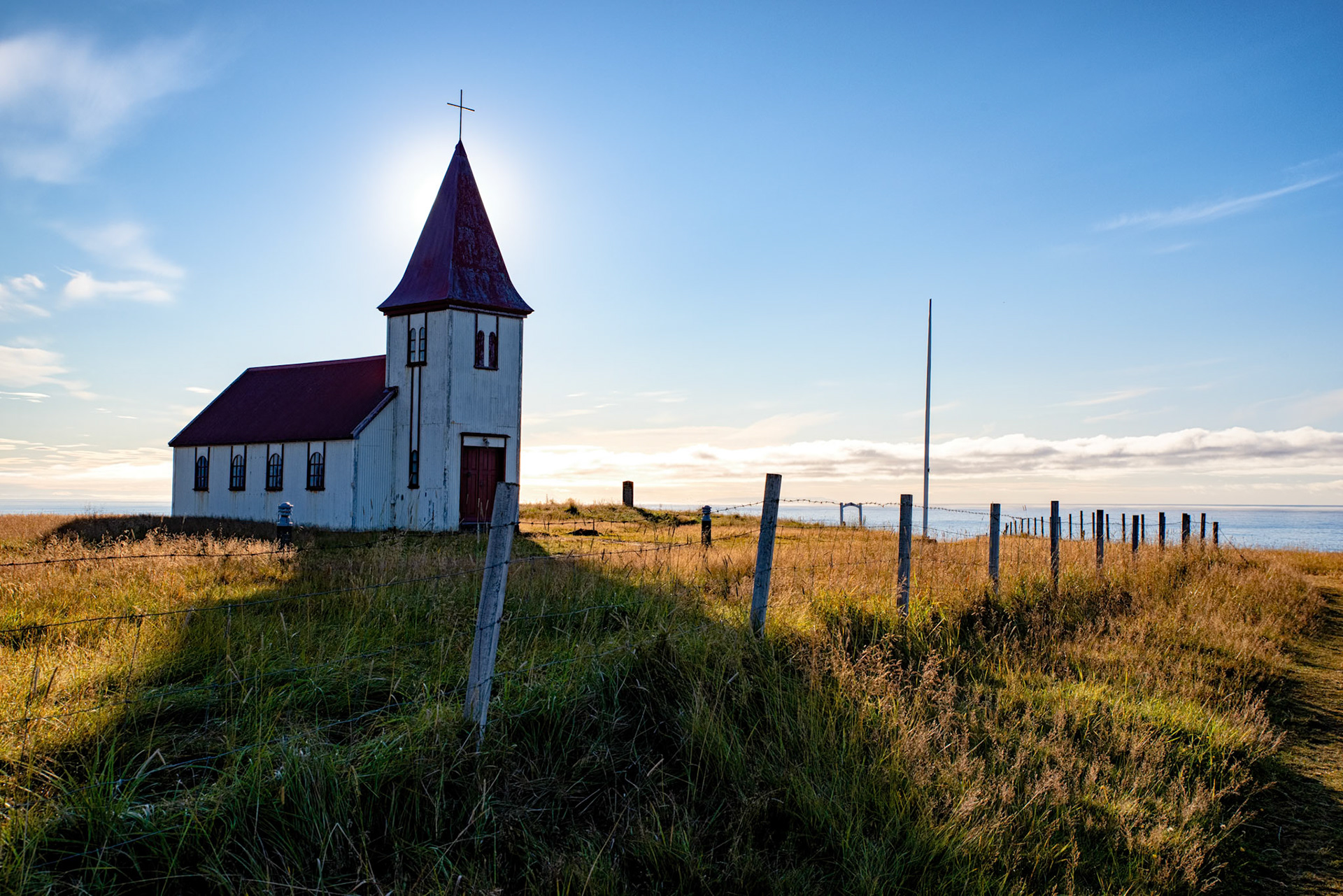 256:365 - A Backlit Church: One of the many small churches of Iceland, this time backlit by the sun, with the Atlantic ocean in the background