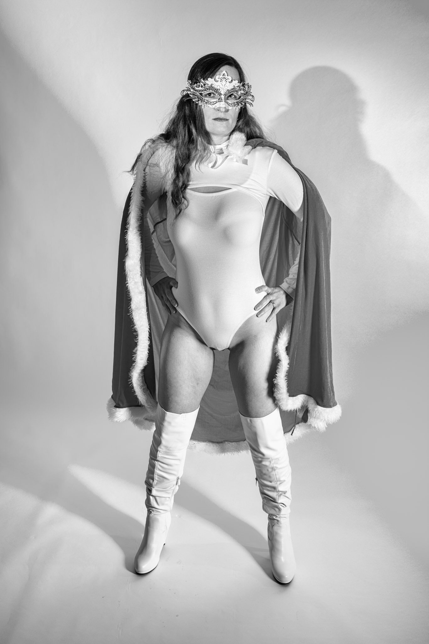 Super Heroine - Here to Save the Day: Trying out a basic superheroine costume. Godox v1 w/ snoot for face, v1 w/ 30x120cm for general, and AD200 w/ red gel for backdrop.