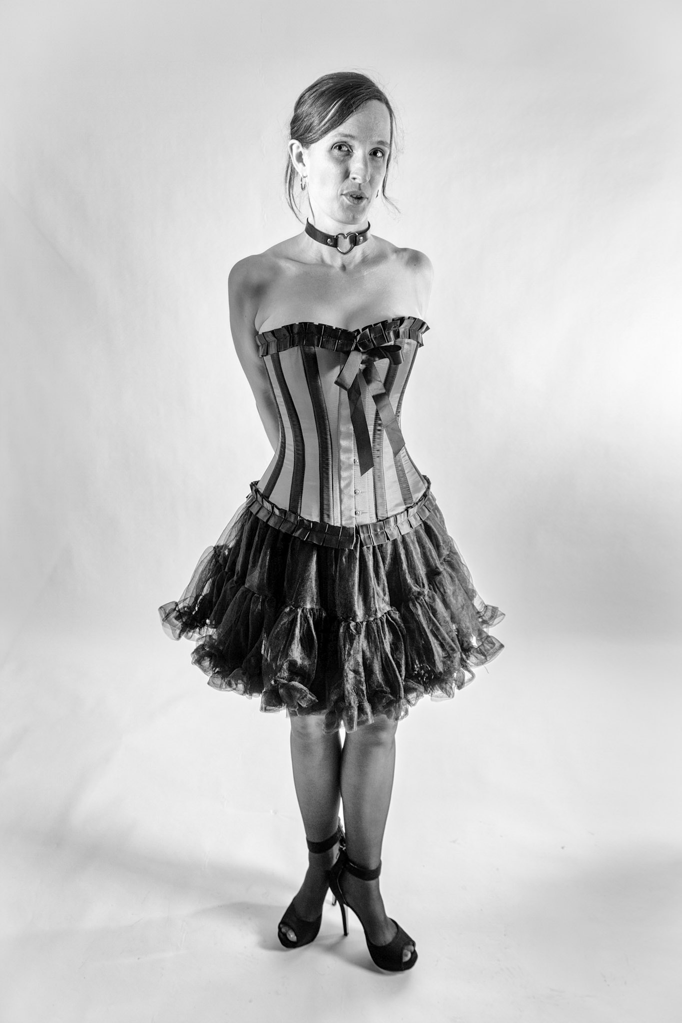 Western Corsetry - A Dangerous Game: The tension of a tightened lace and a look that promises everything while revealing nothing.
