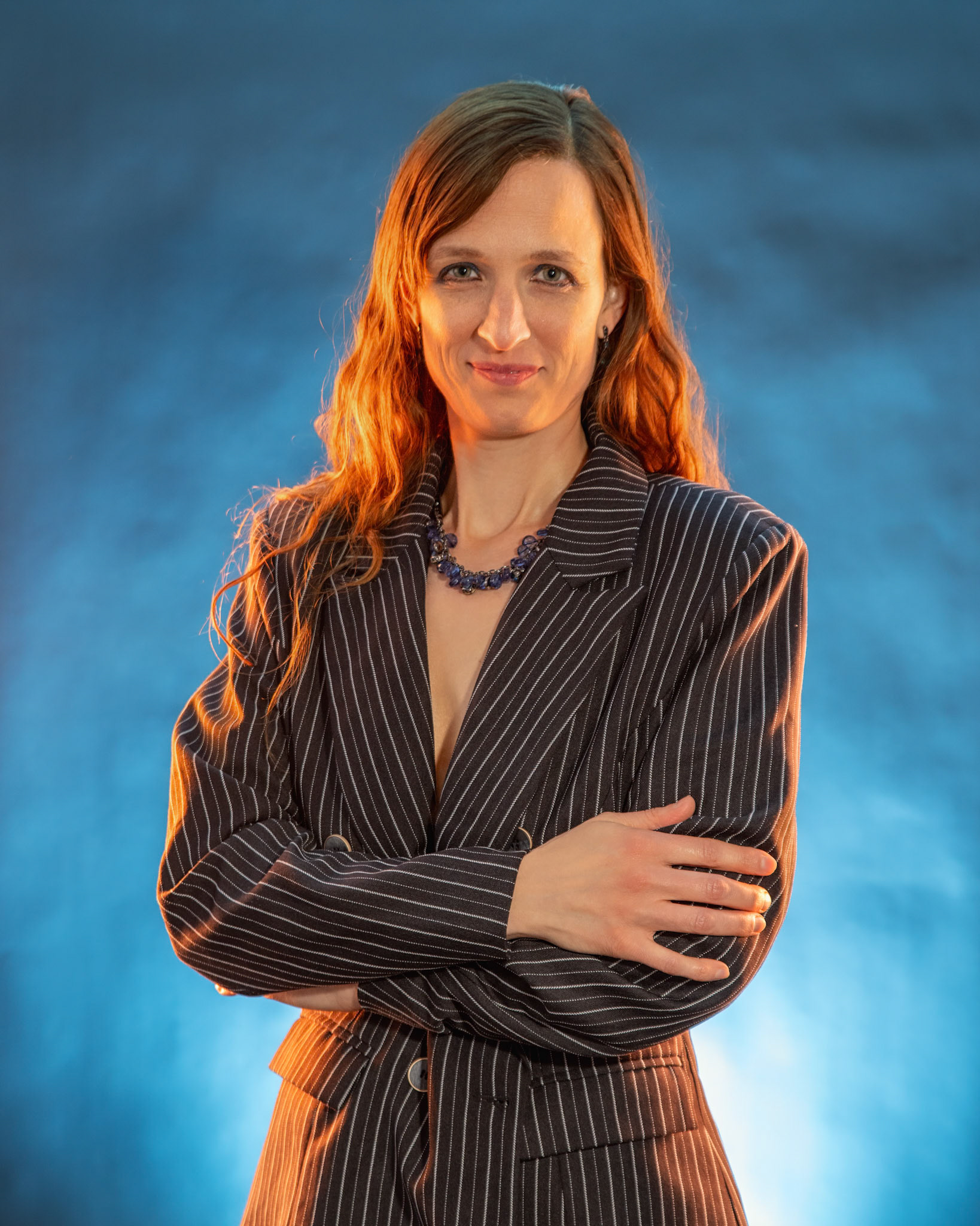 Short Skirt and a Long Jacket - Arms Crossed: Cake themed shoot today, lit by the sides by Godox AD200 pros in 30x120 softboxes with yellow gel. Backlight lit by V1 with a blue gel. Main flash also a V1 with a grid and white cloth softener.