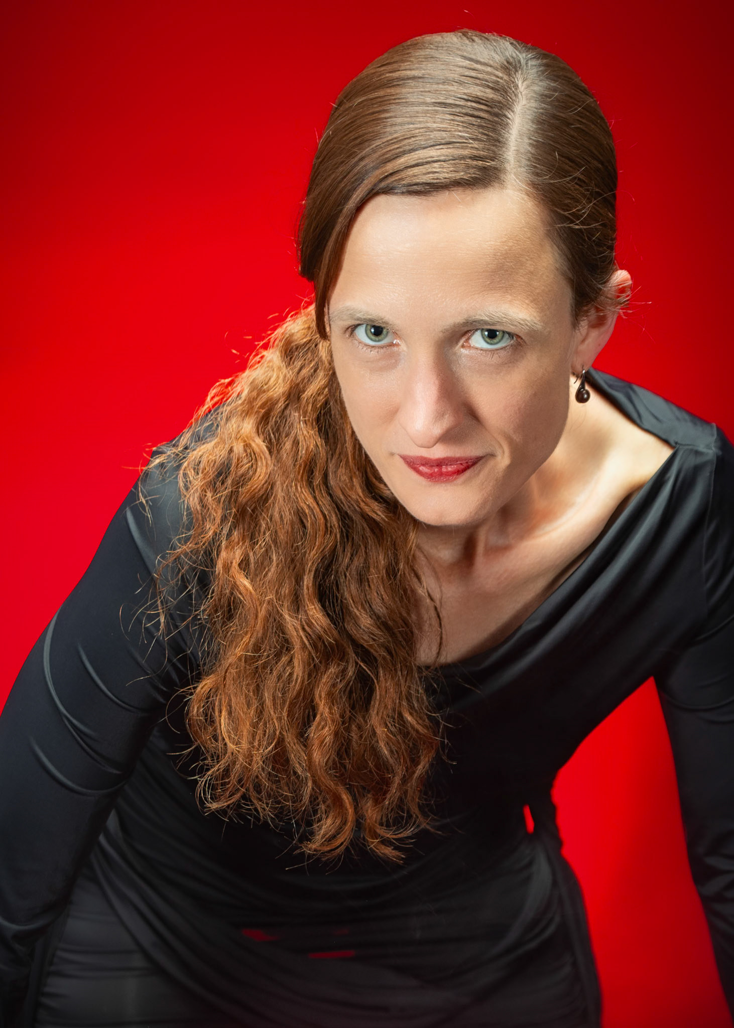 Little Black Dress - The Stare: Taking advantage of rain, we setup a new backdrop from Prime week and some new dresses. Godox V1 above and on backdrop (with red gel). Godox AD200 front left and front right for fill light in 120x30 softboxes.