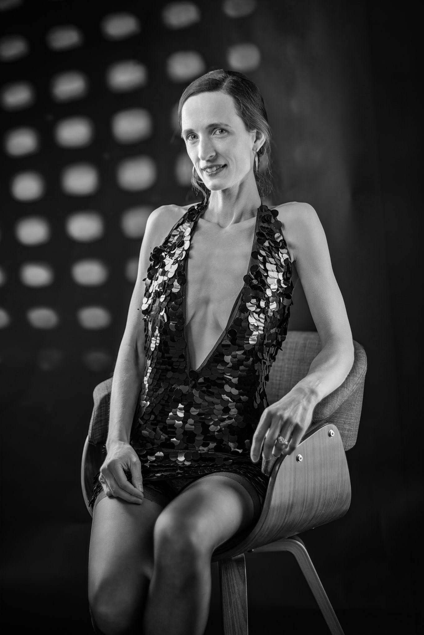 Midnight Edge - Whispers in Black: Stripped back to essential contrast and texture. The deep v-neck and the subject’s subtle, knowing expression evoke a quieter, more powerful narrative.