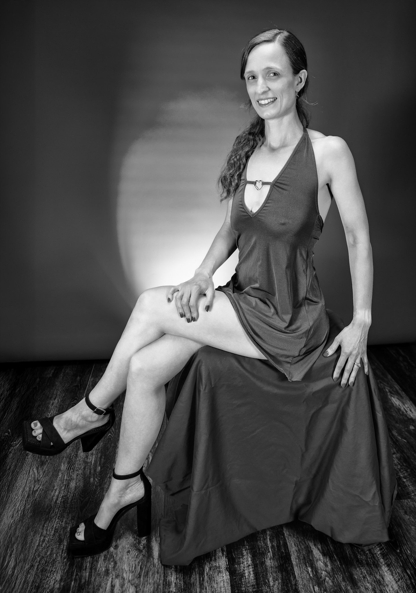 Little Teal Dress - Seated (B&amp;W): Taking advantage of rain, we setup a new backdrop from Prime week and some new dresses. Godox V1 above and on backdrop (with red gel). Godox AD200 front left and front right for fill light in 120x30 softboxes.