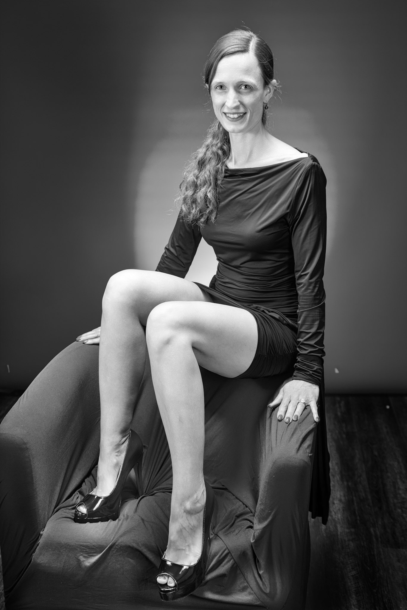 Little Black Dress - Chair Sit (B&amp;W): Taking advantage of rain, we setup a new backdrop from Prime week and some new dresses. Godox V1 above and on backdrop (with red gel). Godox AD200 front left and front right for fill light in 120x30 softboxes.