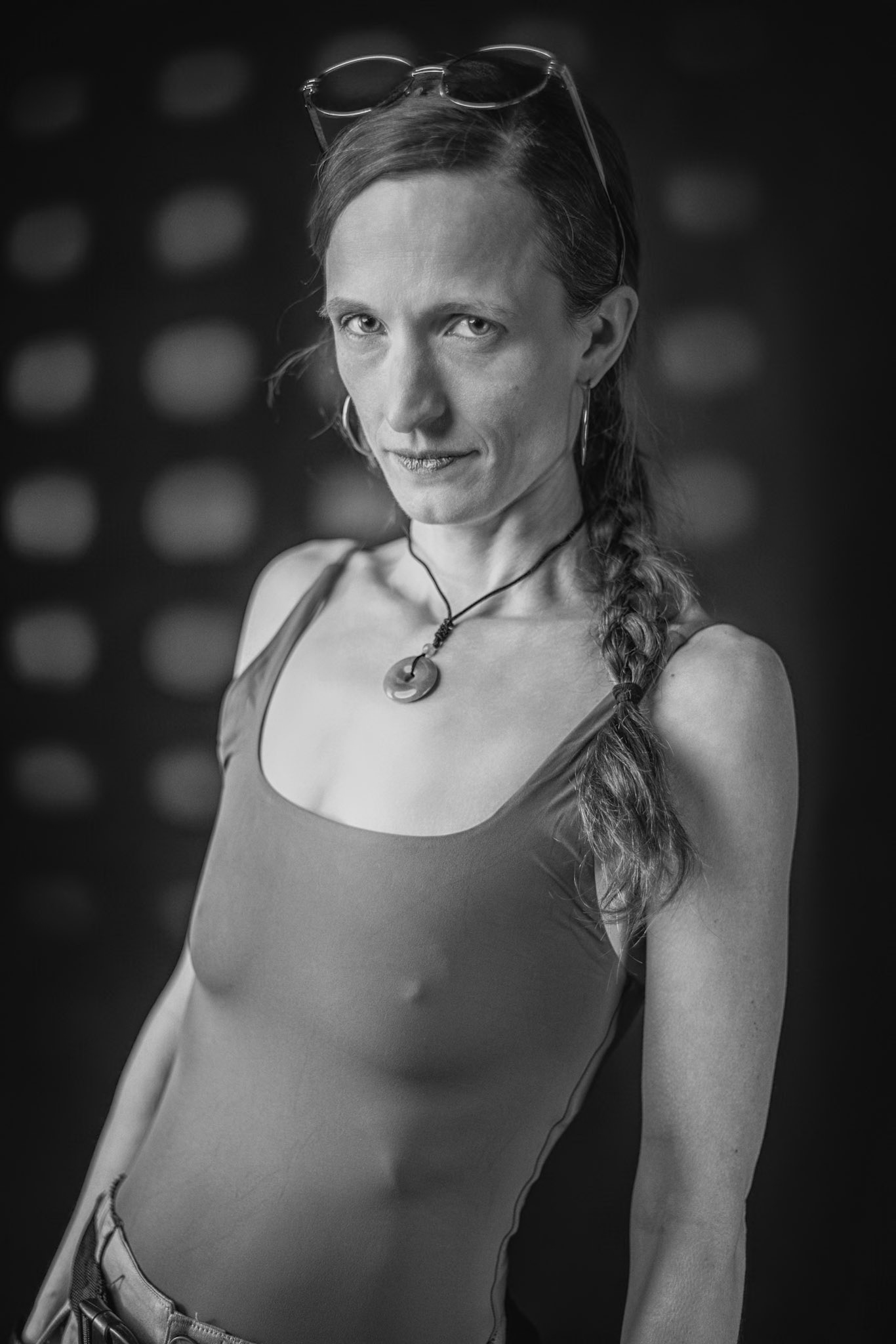 Lara Croft - Artifact of Intent (B&amp;W): Beyond the adventure lies a moment of focused reflection. The composition emphasizes a refined, editorial approach to the iconic aesthetic, utilizing a custom gobo to create an atmospheric, noir-inspired depth. The look of someone who has already solved the puzzle and is waiting for everyone else to catch up. What do you think she’s observing?