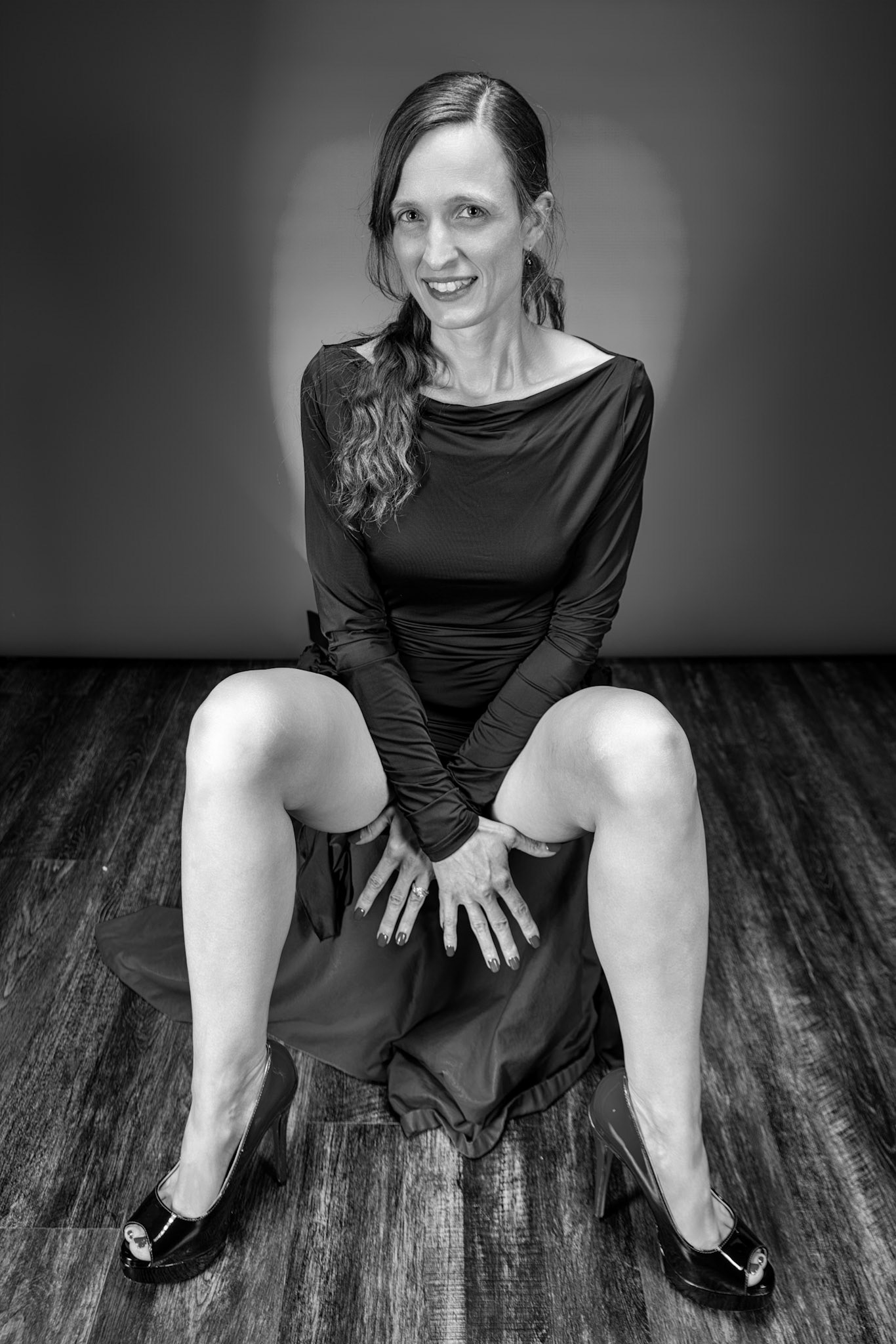 Little Black Dress - Seated (B&amp;W): Taking advantage of rain, we setup a new backdrop from Prime week and some new dresses. Godox V1 above and on backdrop (with red gel). Godox AD200 front left and front right for fill light in 120x30 softboxes.