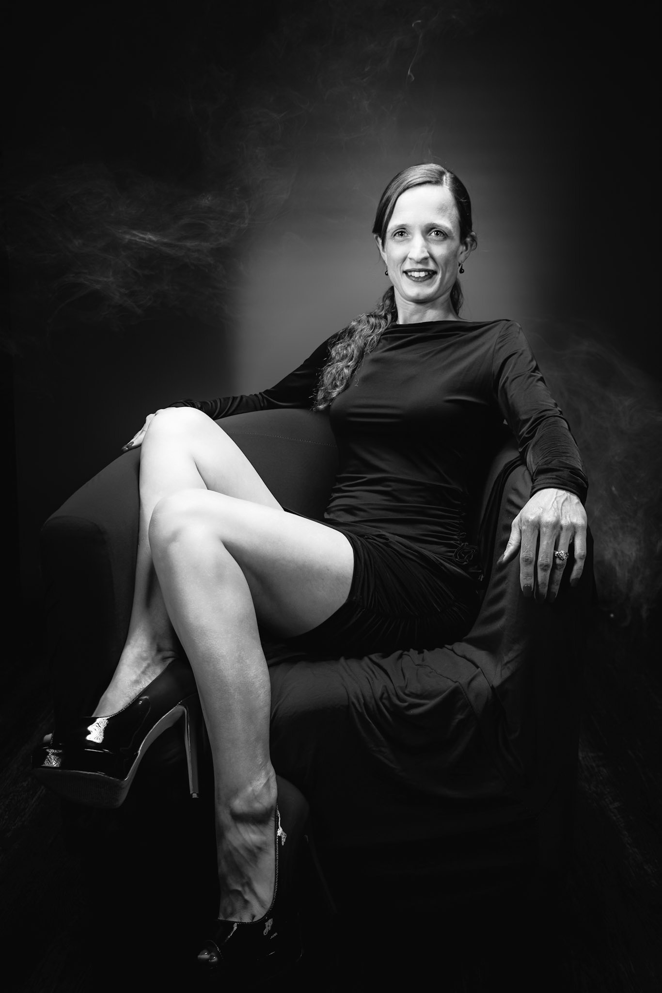 Little Black Dress - Chair Sit (B&amp;W): Taking advantage of rain, we setup a new backdrop from Prime week and some new dresses. Godox V1 above and on backdrop (with red gel). Godox AD200 front left and front right for fill light in 120x30 softboxes.