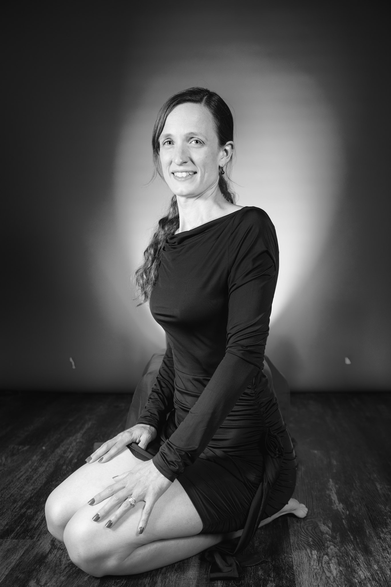 Little Black Dress - Kneeling (B&amp;W): Taking advantage of rain, we setup a new backdrop from Prime week and some new dresses. Godox V1 above and on backdrop (with red gel). Godox AD200 front left and front right for fill light in 120x30 softboxes.