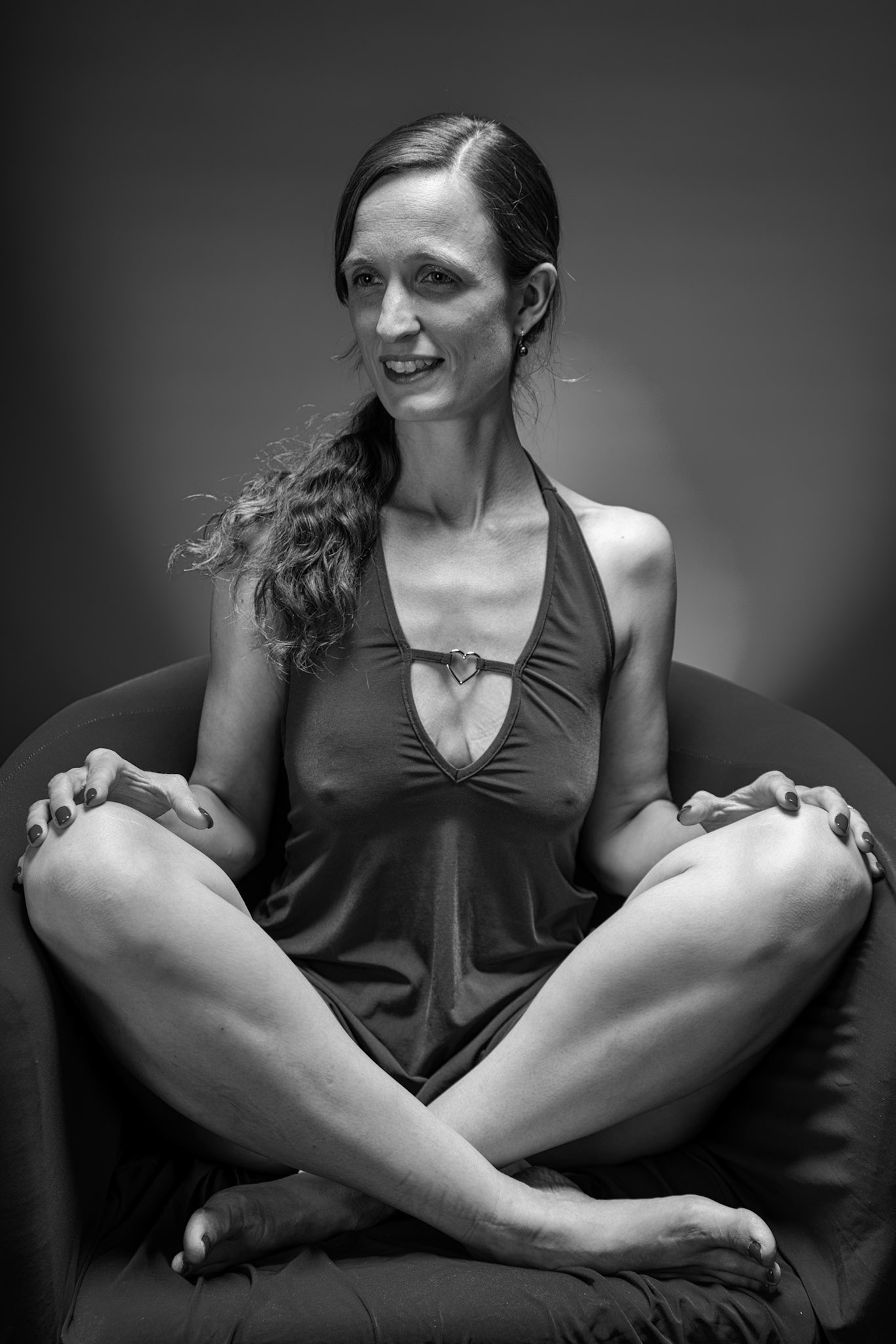Little Teal Dress - Cross-Legged (B&amp;W): Taking advantage of rain, we setup a new backdrop from Prime week and some new dresses. Godox V1 above and on backdrop (with red gel). Godox AD200 front left and front right for fill light in 120x30 softboxes.