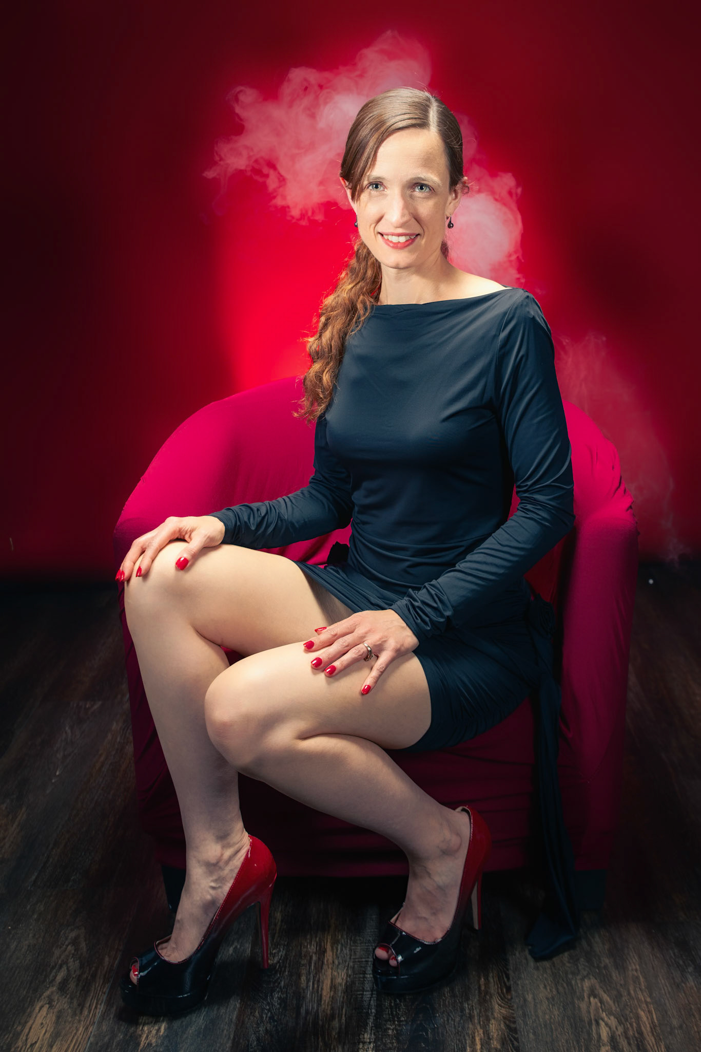 Little Black Dress - Crimson Fever: Bringing the heat in a classic silhouette. A study in saturation and allure, where the intensity of the background is only matched by the intensity of the presence.