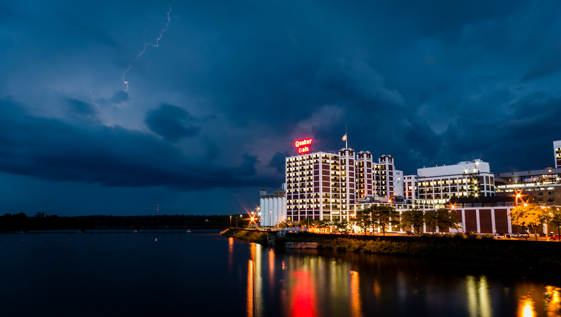 I went downtown in the hopes of getting some car light trails after a storm went through. When the storm decided to bypass downtown instead, I ended up trying to capture the lightning behind a local icon, the Quaker Oats cereal factory. I really enjoyed the reflections from the plant, combined with the moodiness of the clouds. Unfortunately, the storm proved uncooperative in this change of focus as well, resulting in only cloud-to-cloud lightning being captured, instead of the desired cloud to ground form.
