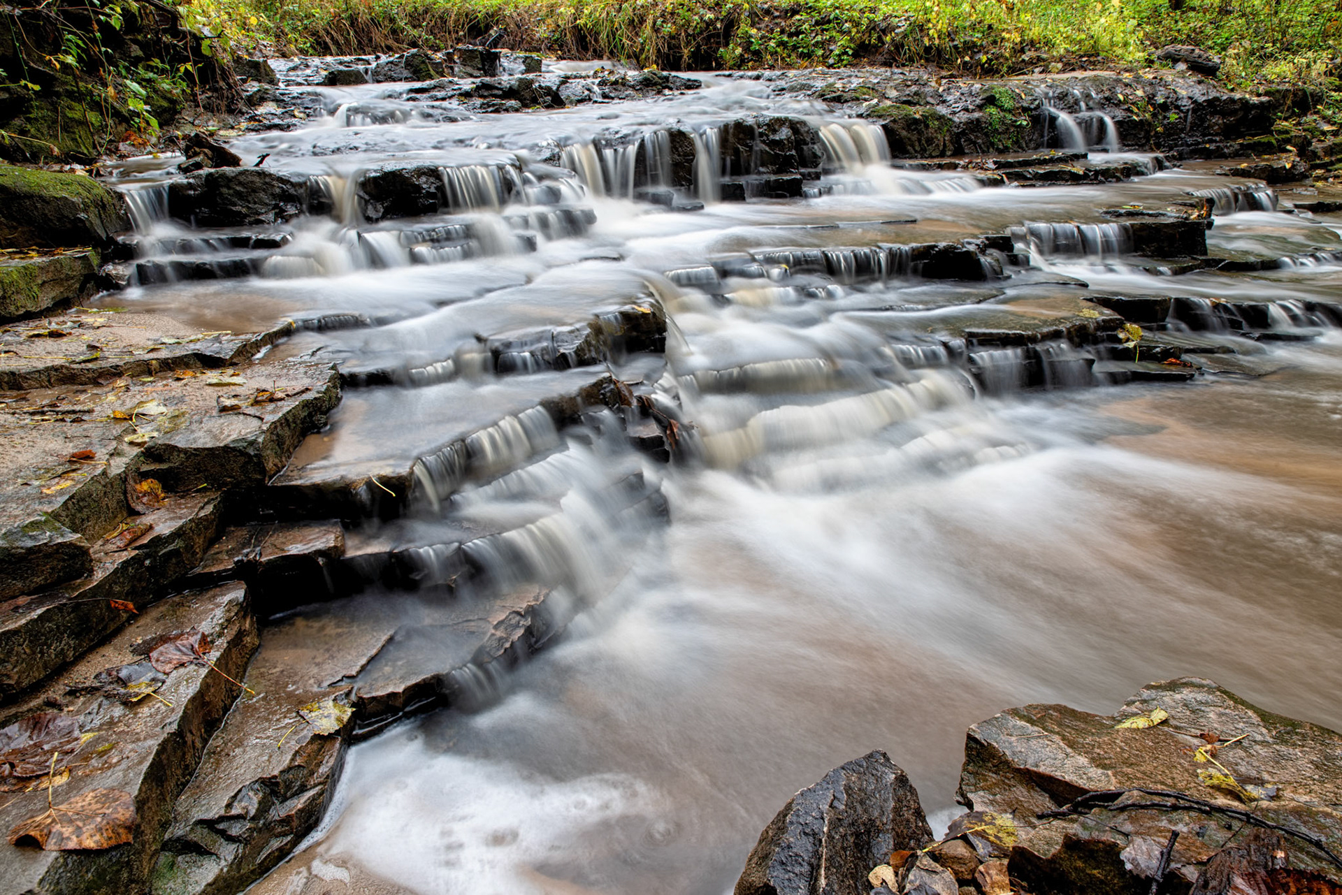 279:365 - Flooded Falls: Normally I don't think the Horseshoe falls at a local park are anything spectacular, but I decided to see if the heavy rain we're getting would improve them. Taking a chance for a hike between rain storms, it paid off, with multiple shots of the falls that I liked. This one was my favorite, so it gets the pick as today's photo.