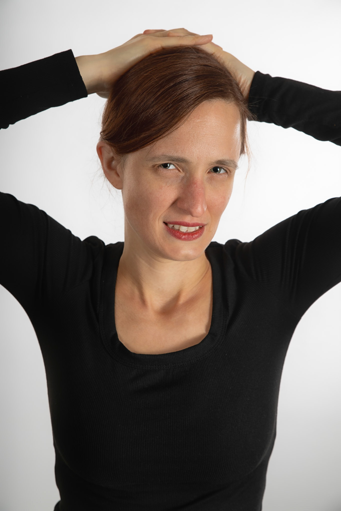 Black and Tan - Disgust: Godox V1 front left w/ white umbrella, front right in 30x120 softbox. Godox AD200 behind white seamless backdrop.