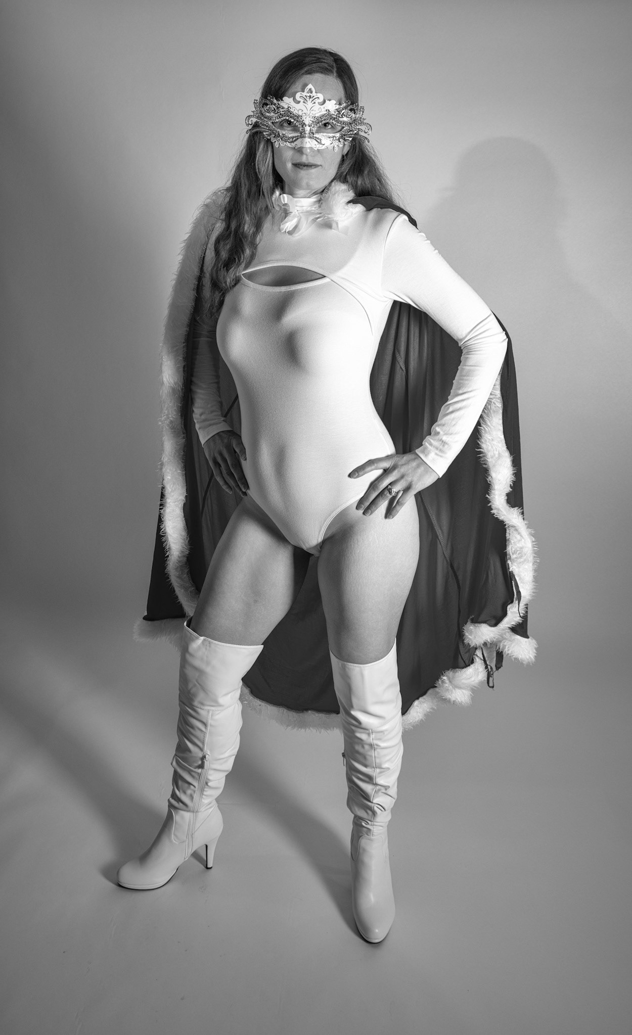 Super Heroine - Here to Save the Day: Trying out a basic superheroine costume. Godox v1 w/ snoot for face, v1 w/ 30x120cm for general, and AD200 w/ red gel for backdrop.