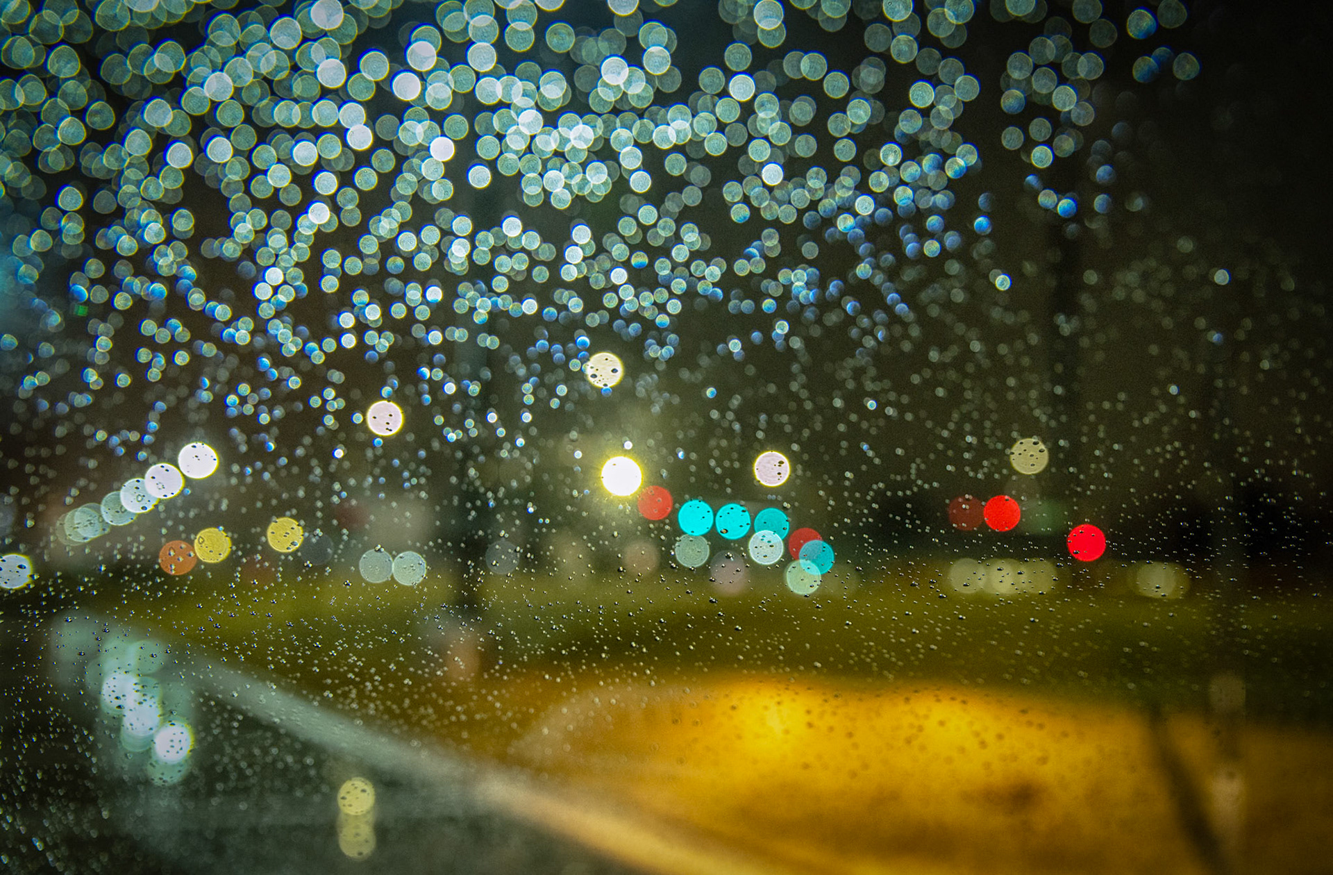 22:365 - Soft: I greeted the weather this morning with excitement. Rain and fog, what could be better? I wanted to try experimenting with different water droplet shots. I liked this approach for more of an abstract shot of an intersection, although I'm sure my coworkers thought I was crazy as I spent 10 minutes finding the perfect position for the car to line up the shot.