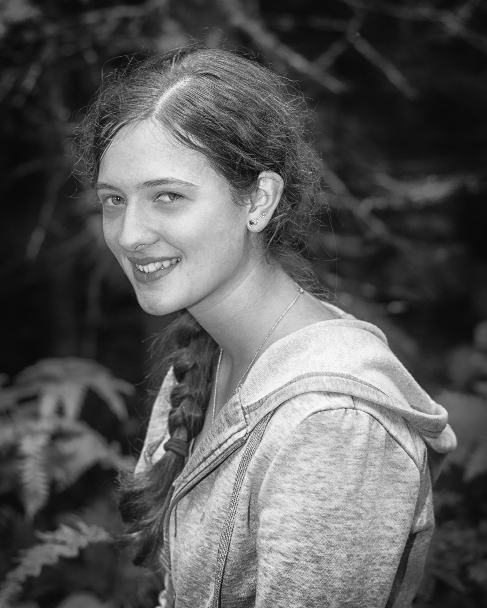 Woman of the Woods - Smiling (B&amp;W): I really struggled with this portrait series, as Elsa is much more at home in the woods than in front of the camera. I decided to embrace that aspect, and re-edited these to be monochrome to highlight that rugged quality.
