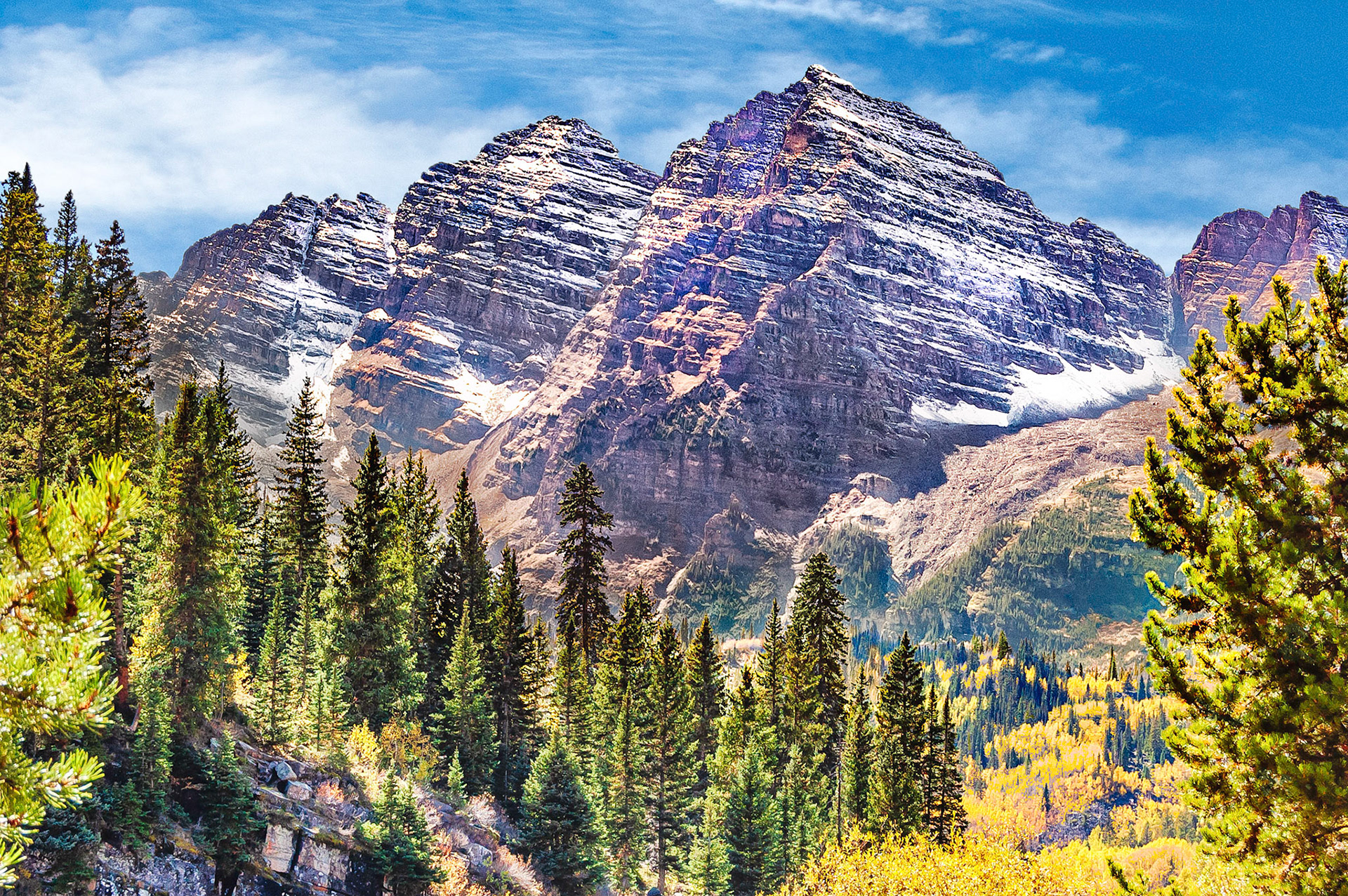 Named after their distinctive maroon colour, the Maroon Bells are iconic peaks in the Elk Mountains of Colorado, USA. The Bells were formed by glacial action on sedimentary mudstone deposits. The tallest, Maroon Peak,  at 14,163 feet, (4,317m), is the 27th highest peak in Colorado.