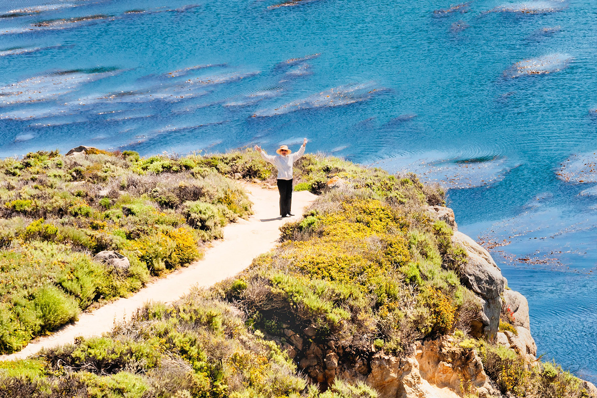Enjoying a beautiful sunny day at Cannary Point in the Point Lobos State Reserve near Carmel, California, USA.