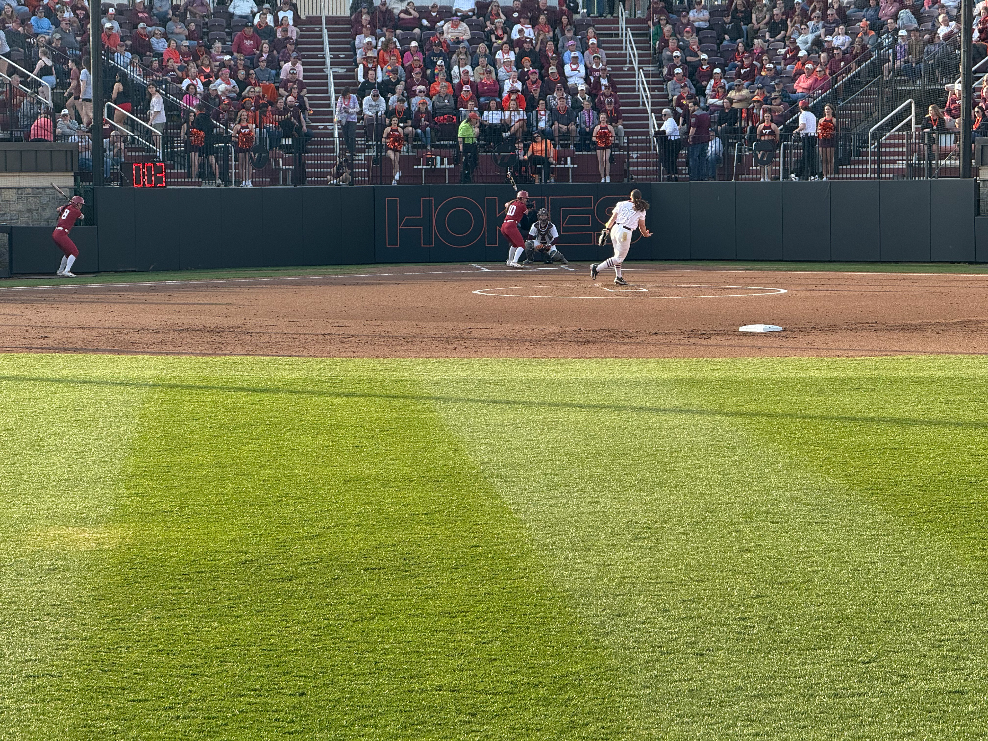 BLACKSBURG, Va., March 28 – Stuck in the Action: Emma Lemley, Virginia Tech’s pitcher, fired a pitch towards Jade Berry, Stanford’s third baseman. Photo: Robert Bateman