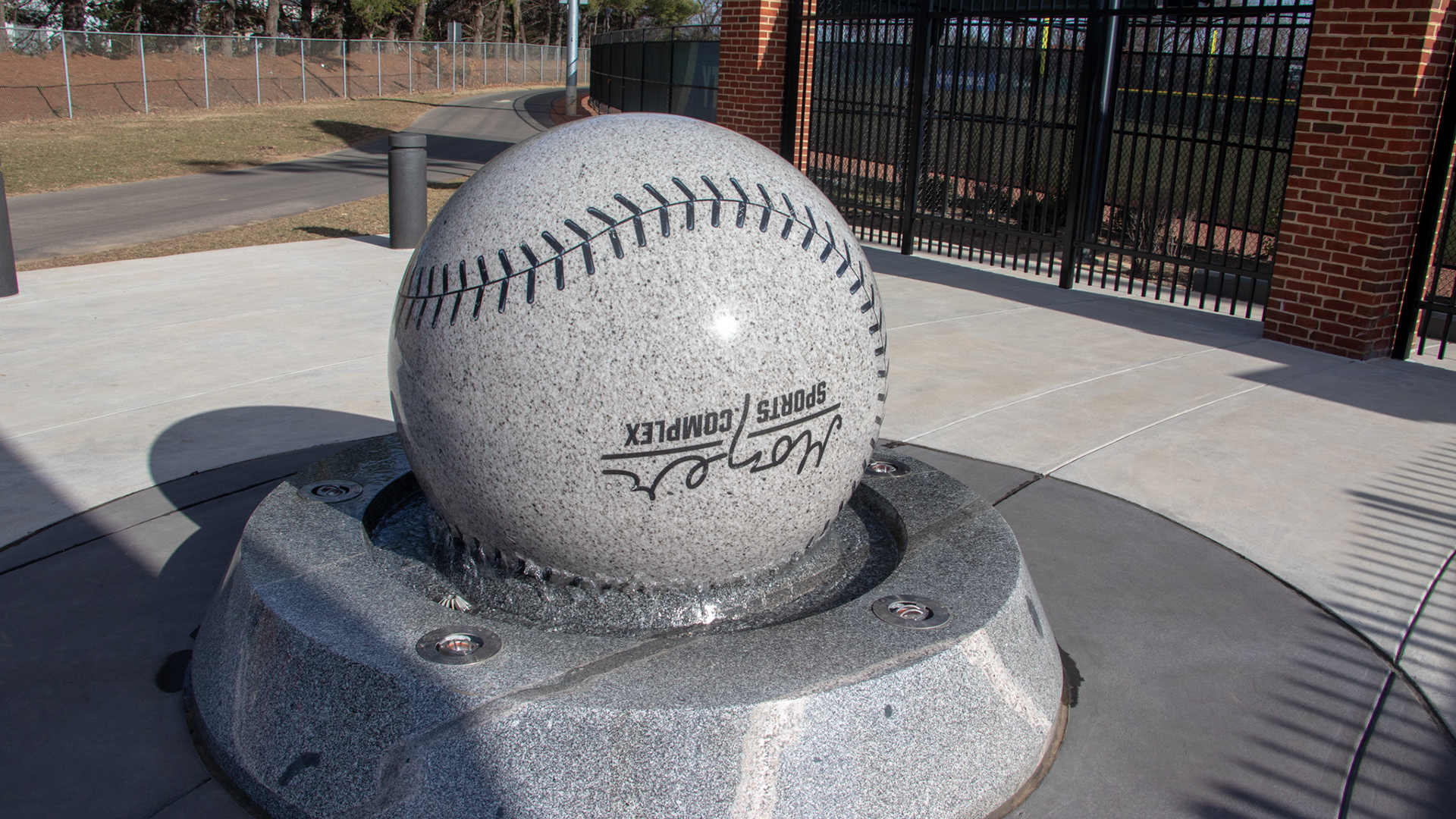 SALEM, Va., March 1, 2025 — Softball Fountain: An upside down softball rotates, reading “Moyer Sports Complex,” while filtering water outside the main entrance. Photo: Sam Mostow
