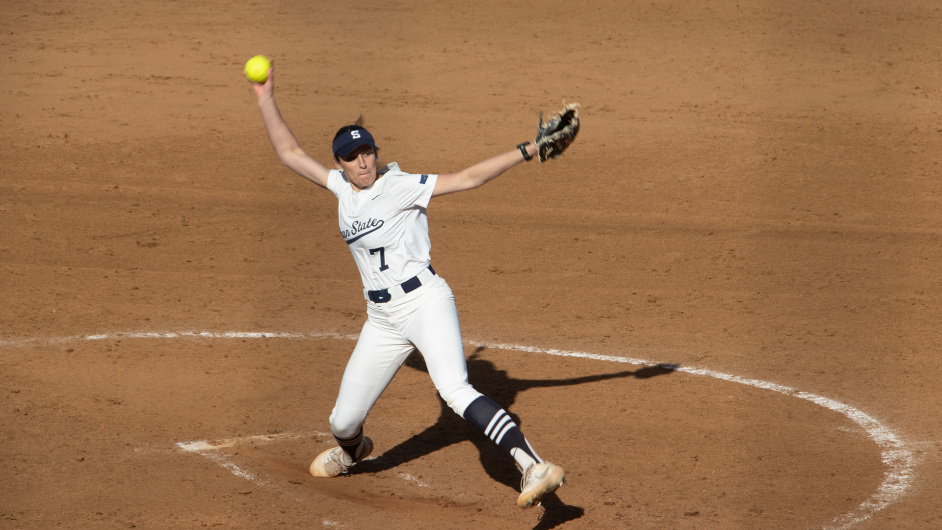 SALEM, Va., March 1, 2025 — Windup: Penn State pitcher Mady Volpe circles her arm back and prepares to fire the softball towards home plate. Photo: Sam Mostow
