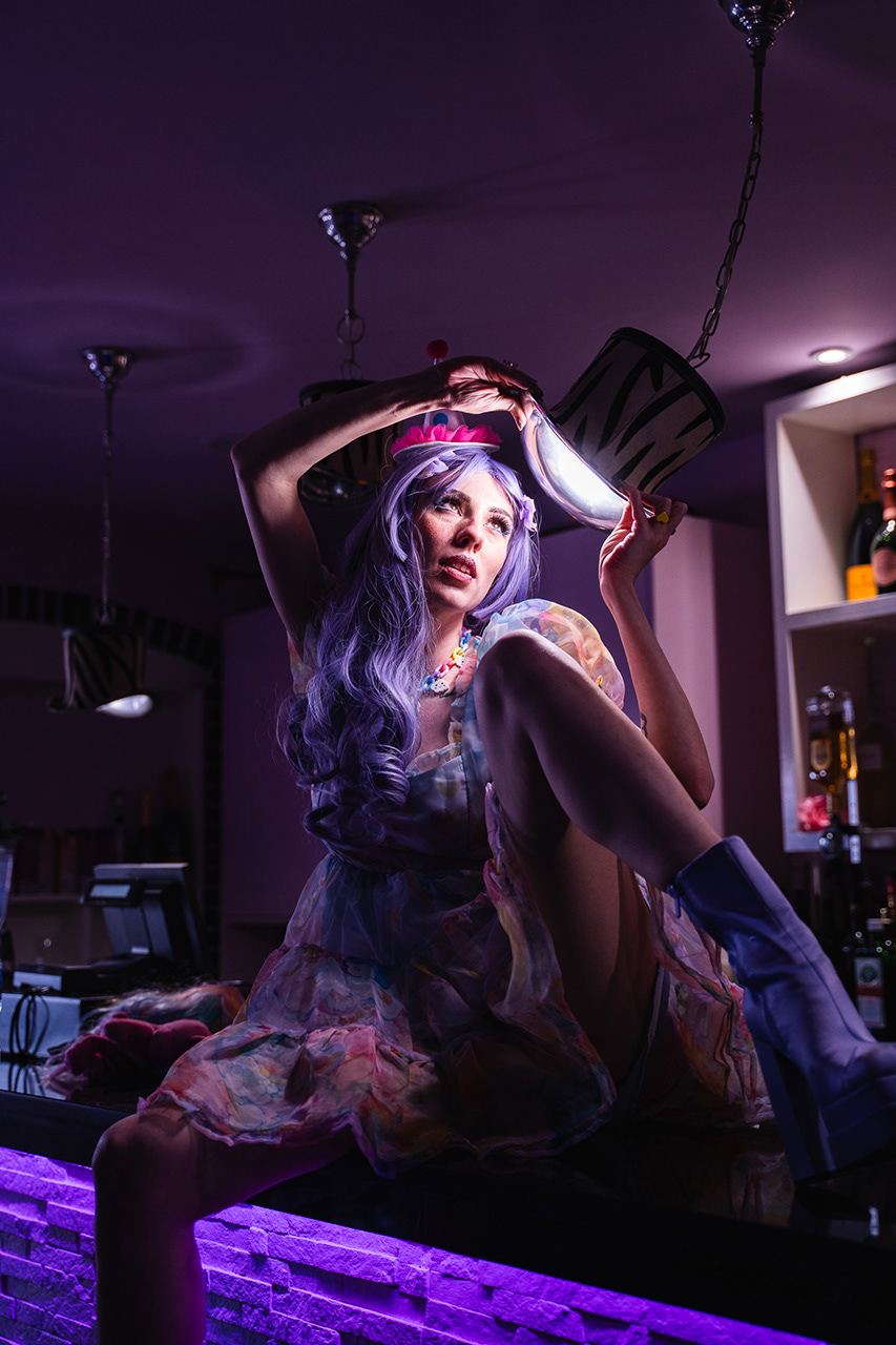 High-resolution, intimate conceptual portrait of a cosplayer, focusing on expressive eyes and intricate details under professional neon-low-key lighting. Art by Arcane Media