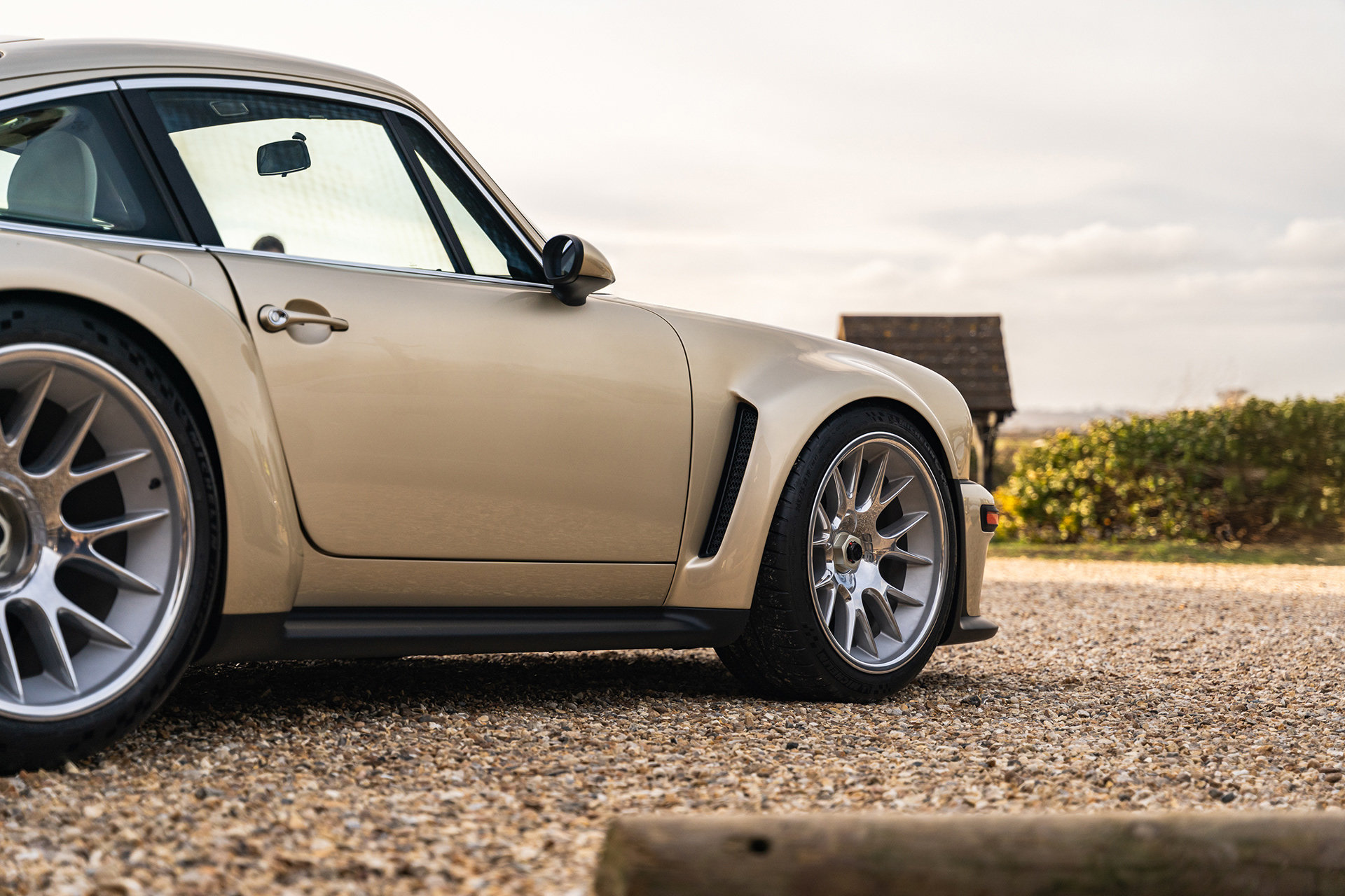 Classic beige Porsche Singer parked outdoors with clean automotive composition
