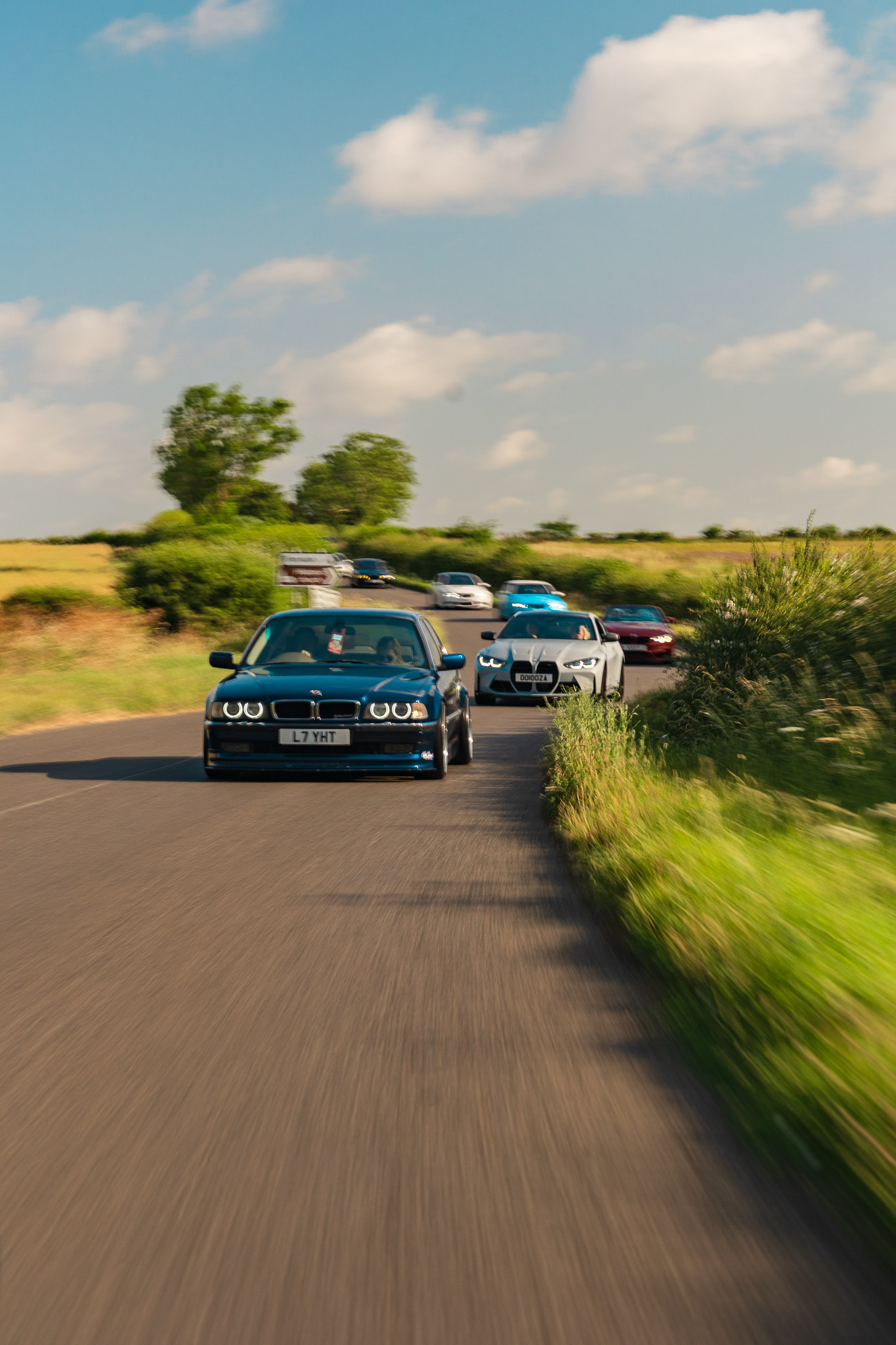 Motion blur roller shot of Bmw convoy led by Bmw B11 Alpina