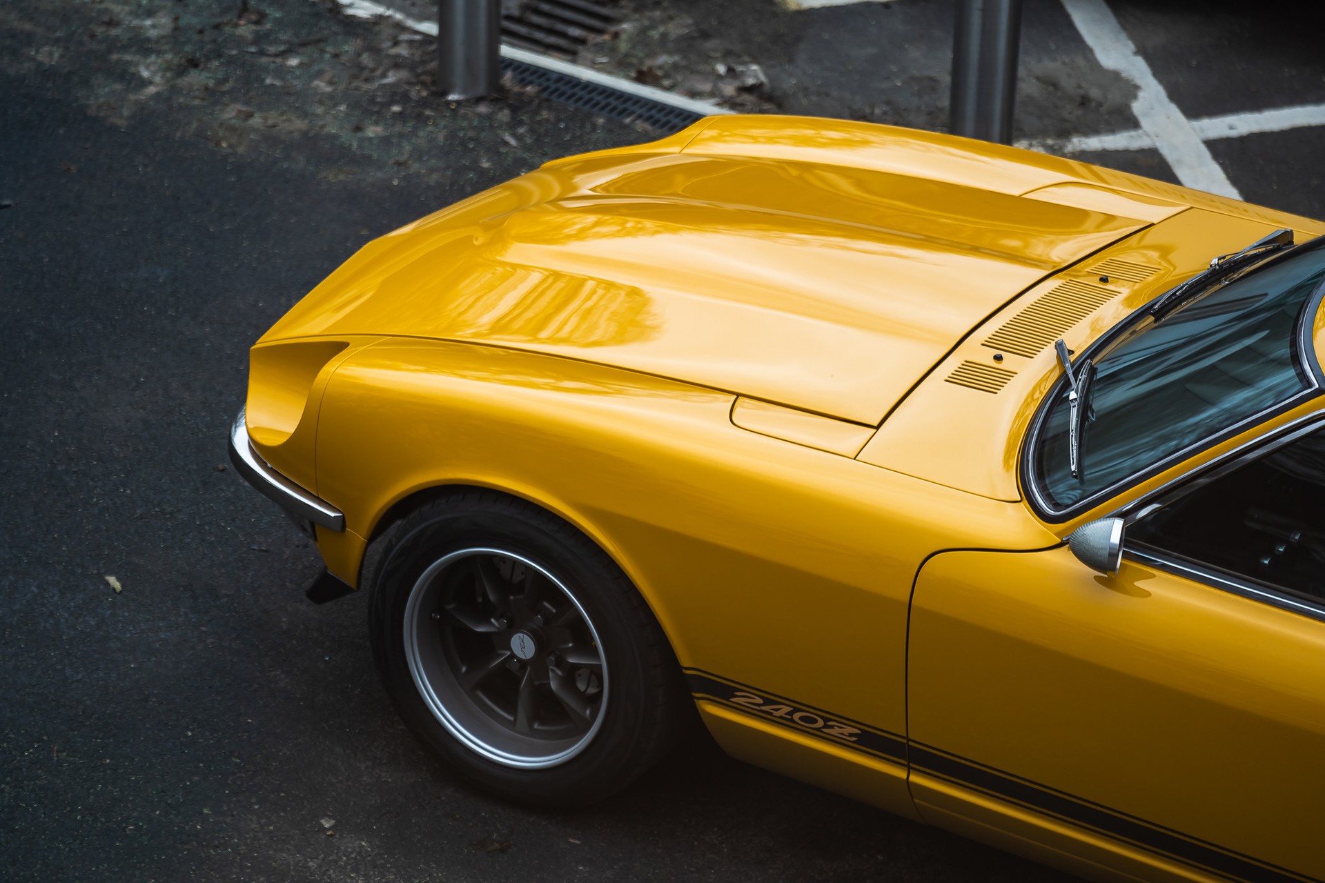 Top angle view of yellow Datsun 240z front end of the car