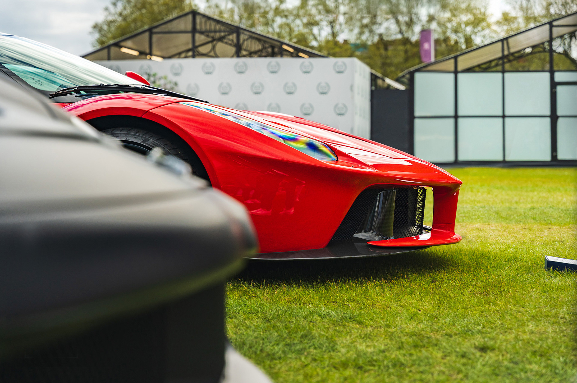 Ferrari La Ferrari parked outdoors with cinematic composition and reflections
