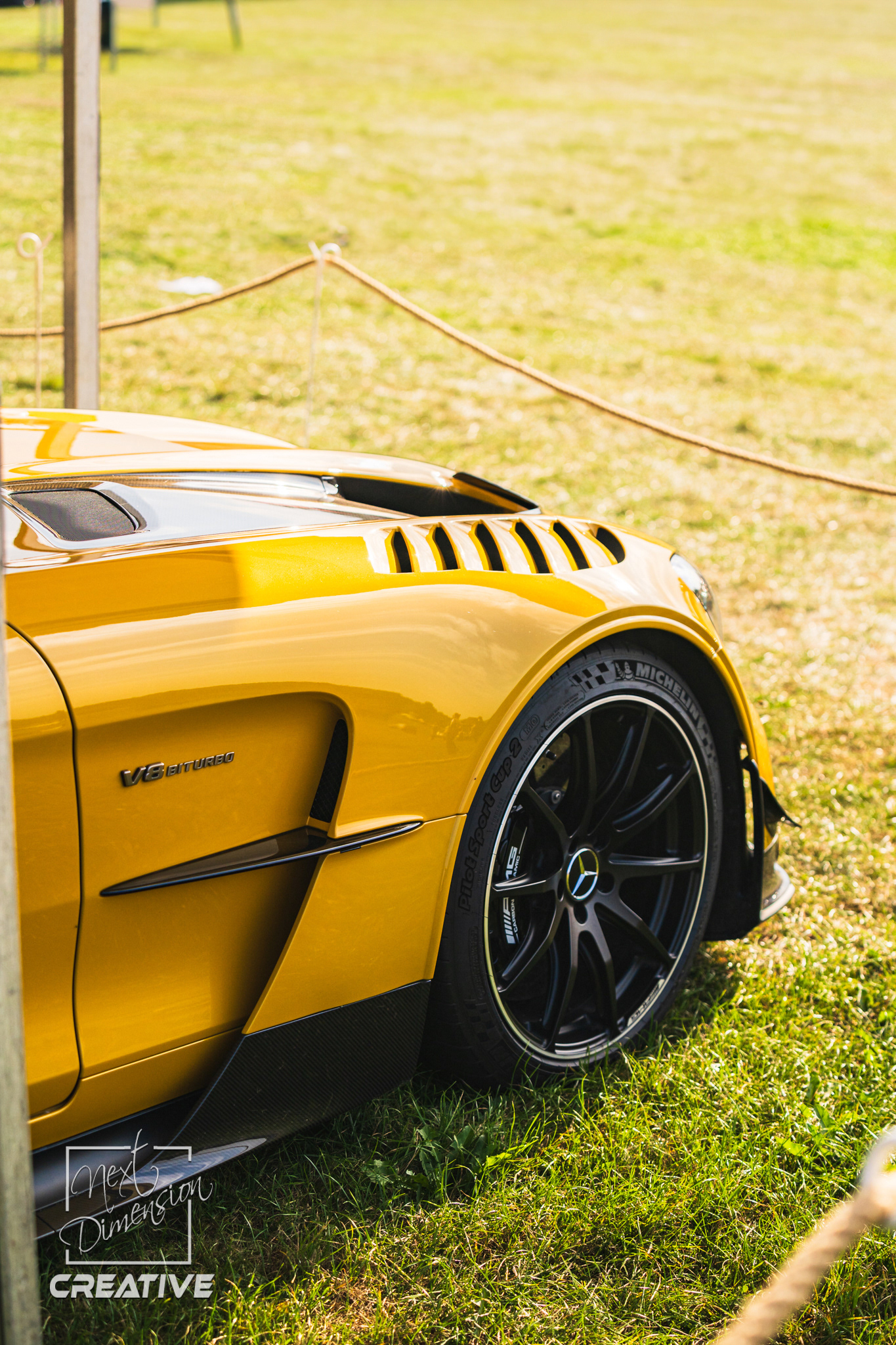Rear view of classic yellow car Mercedes AMG GT Black Edition with carbon fibre details and soft light