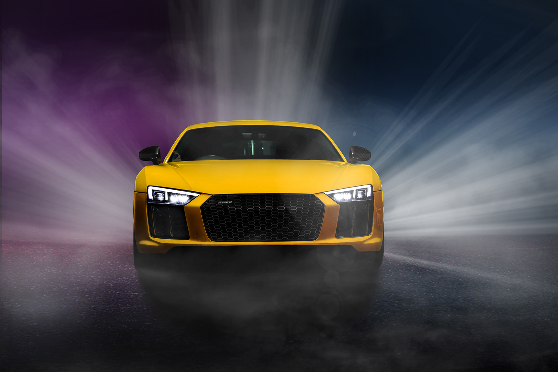 Dramatic commercial automotive portrait of a yellow Audi R8, featuring expert lighting effects and composite retouching. This powerful edit includes symmetric light ray integration and advanced color grading to create a impactful 'hero' shot for a performance brand.