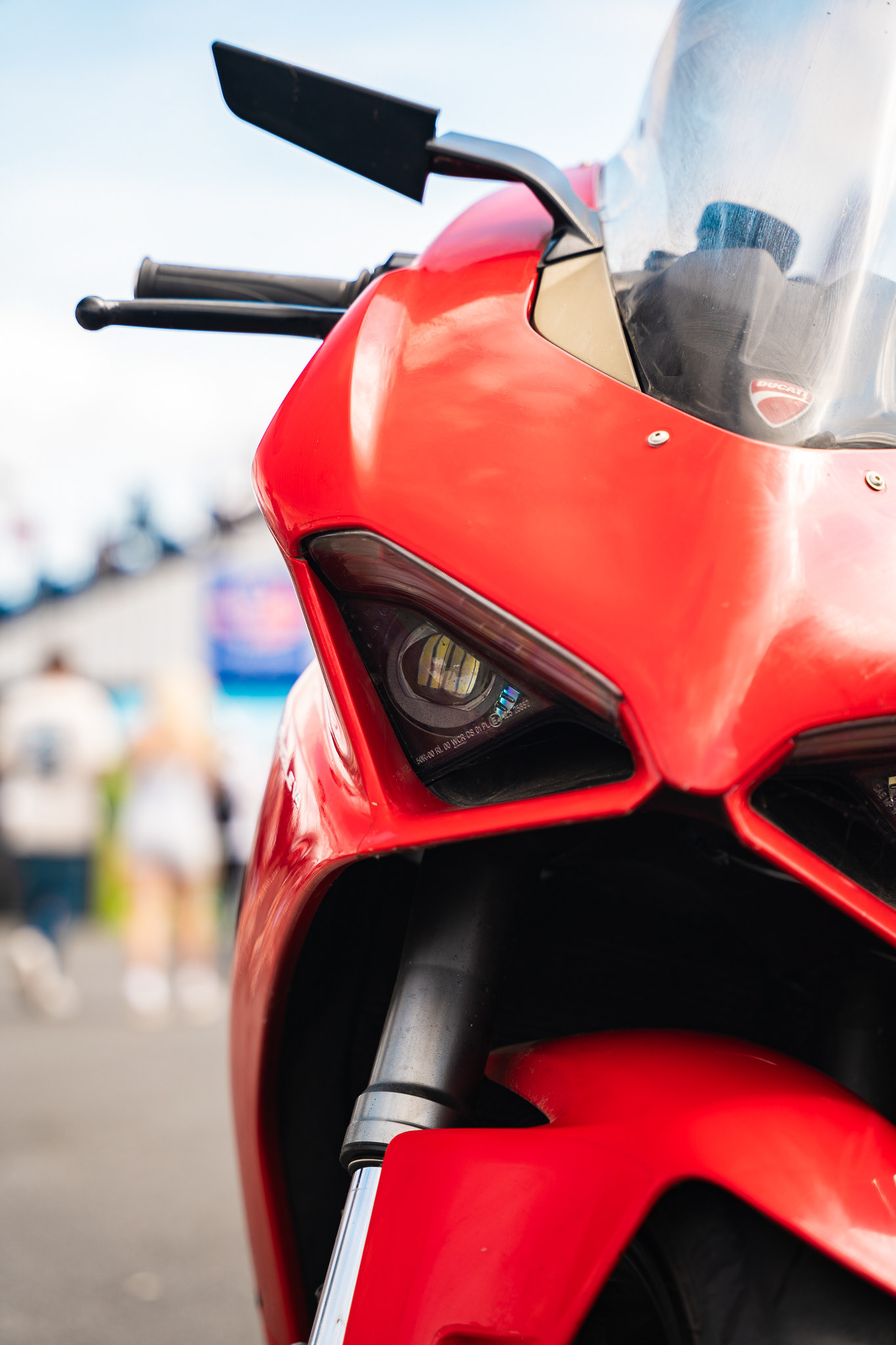 Red sports motorcycle Ducatti parked outdoors with clean close up composition