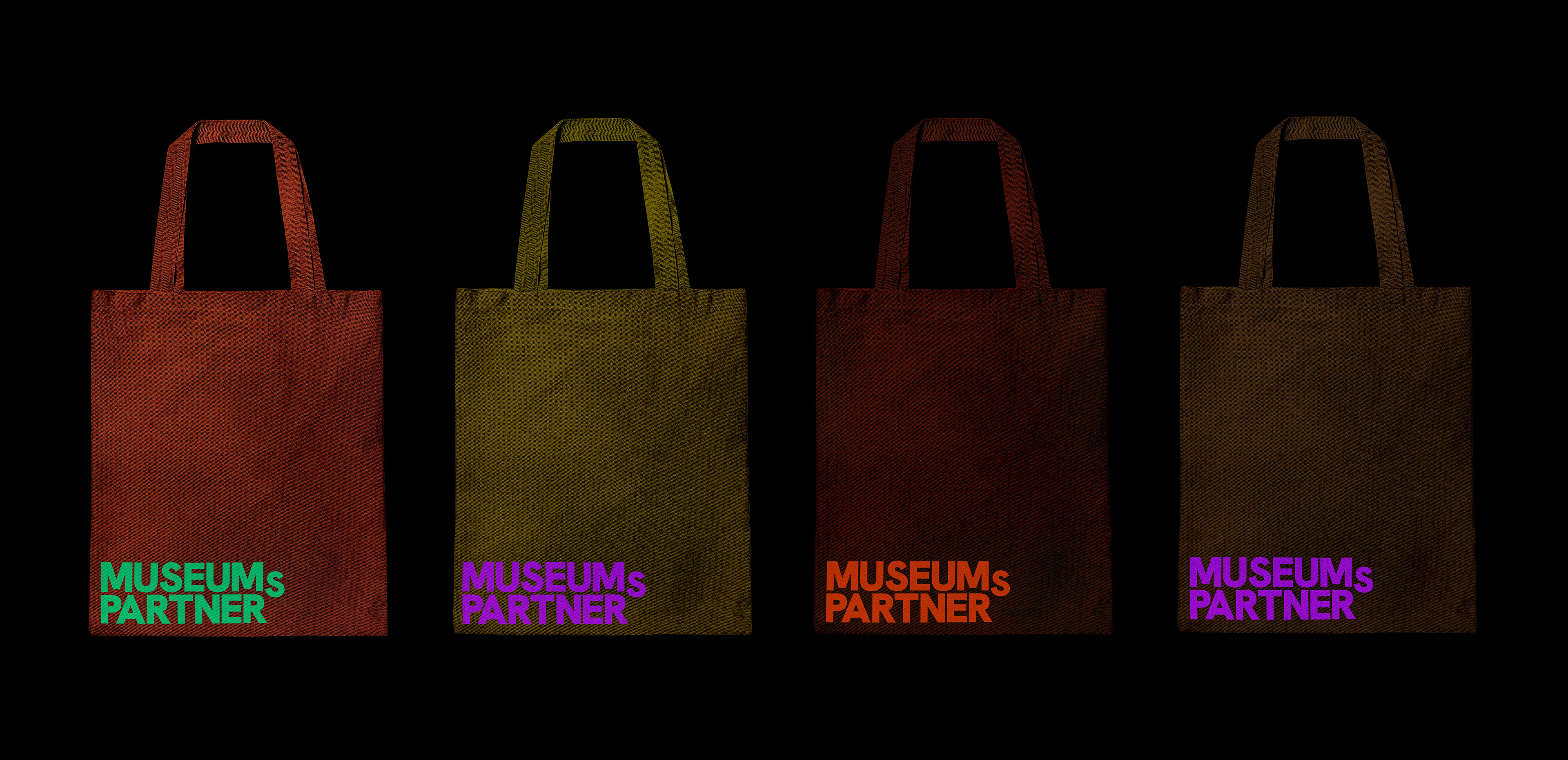 Custom branded tote bags for Museumspartner showcasing the primary corporate color palette, used as promotional merchandise for international art fairs and museum conferences.