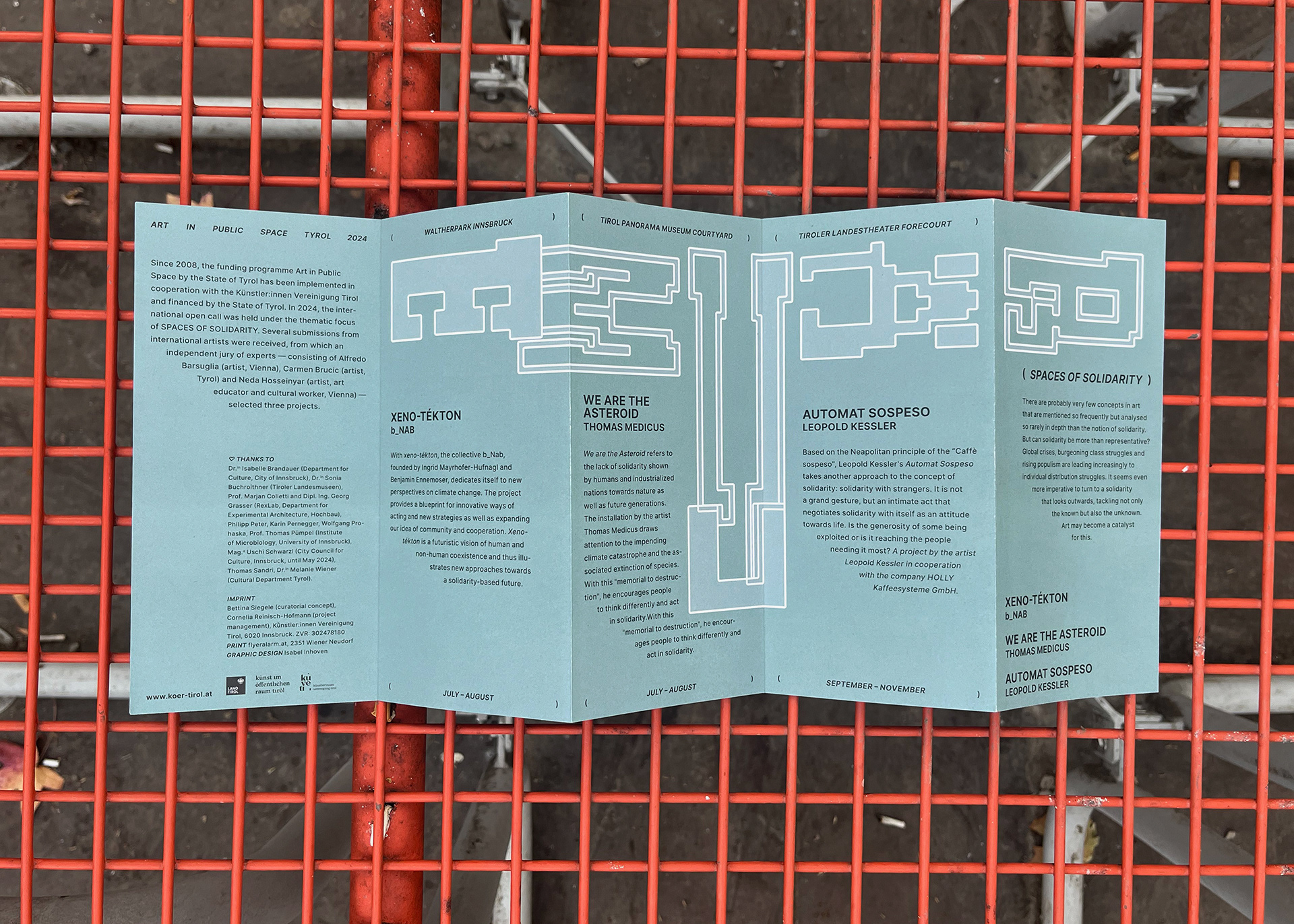 Event folder design for KÖR 24, demonstrating the application of a vibrant brand identity within Innsbruck’s city architecture.