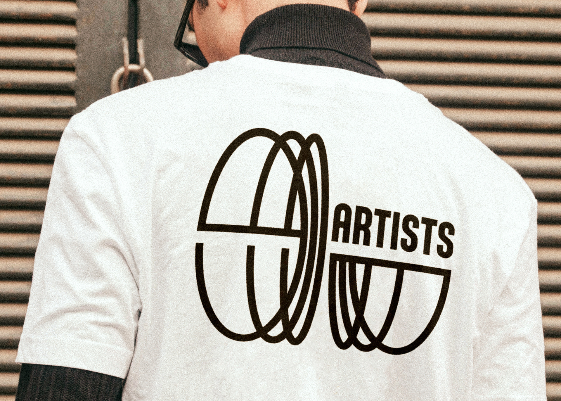 EUartists tour managment merchandise design – logo on the back of a white tshirt