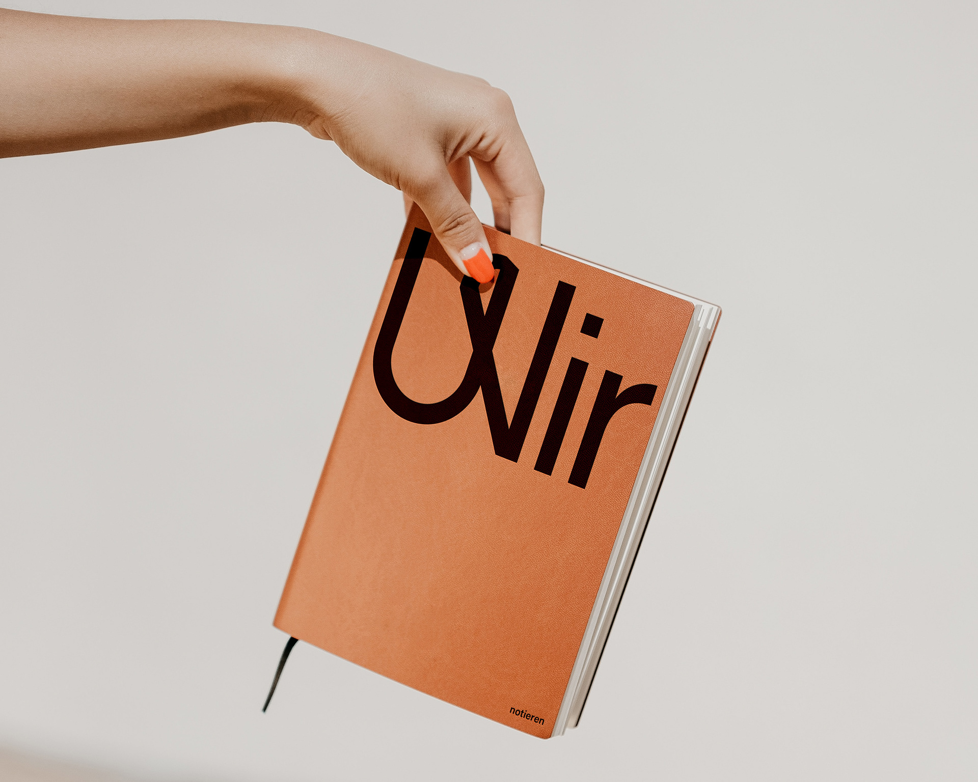 Custom branded stationery for Agentur WIR, featuring a clever typographic lockup that merges the company logo with the functional slogan for taking notes.