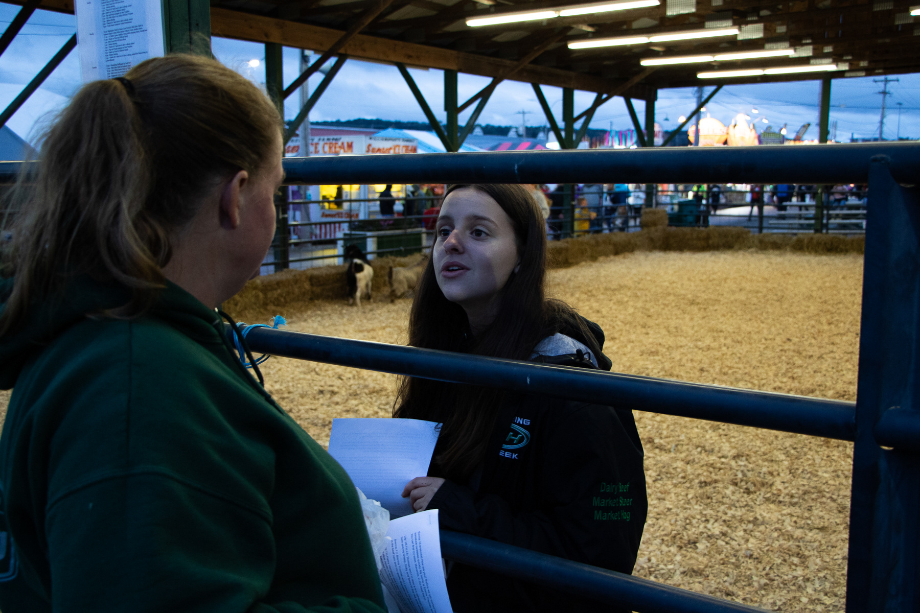 Lily talks with her mother before her and her sisters present an educational show on their fainting goats.