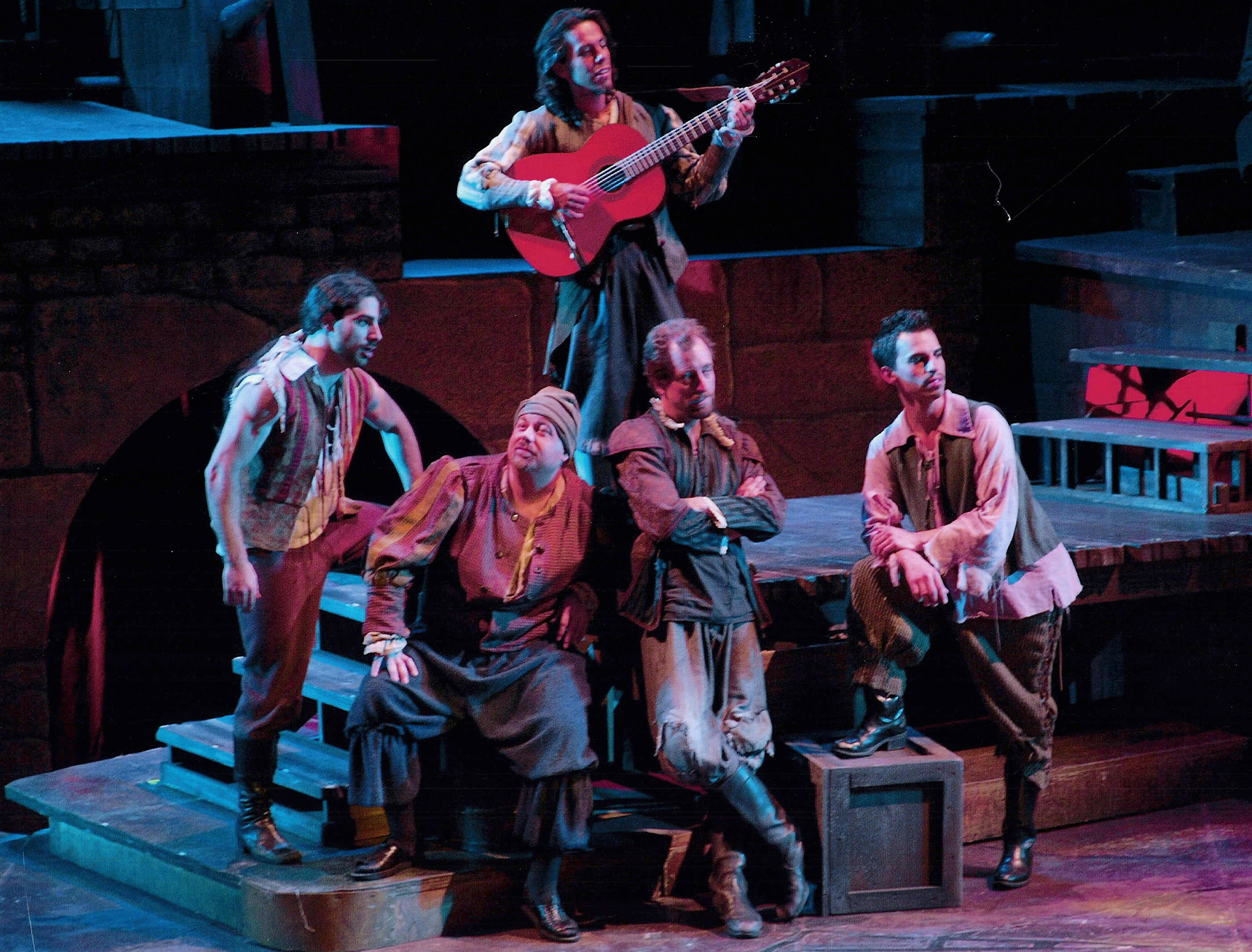 Muleteers muse about Little Bird in Man of La Mancha at Western Stage