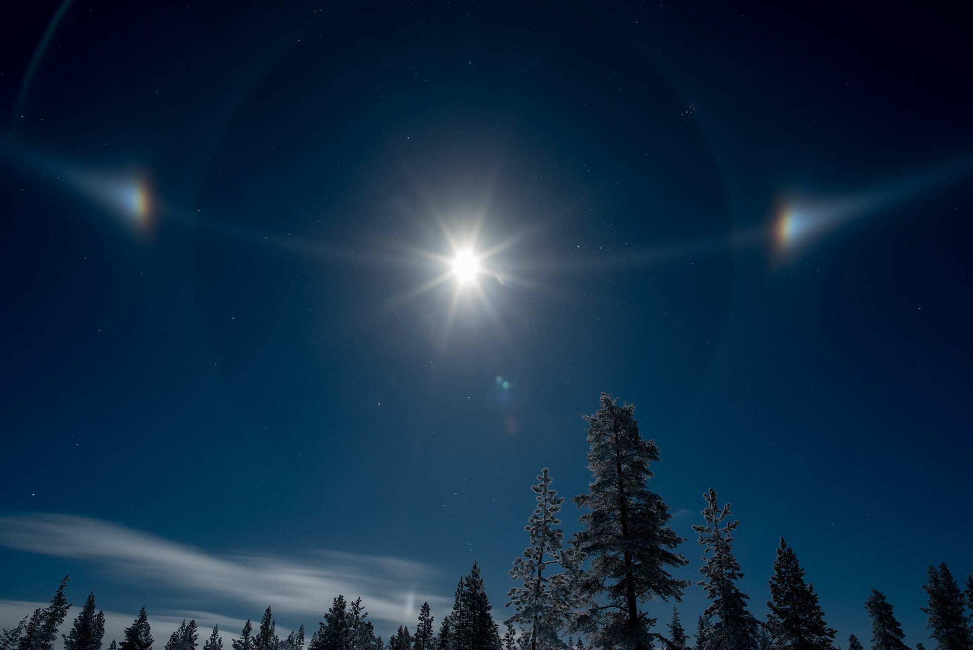 Finnish Lapland. Moonlight, ice crystals and a pair of moon dogs.