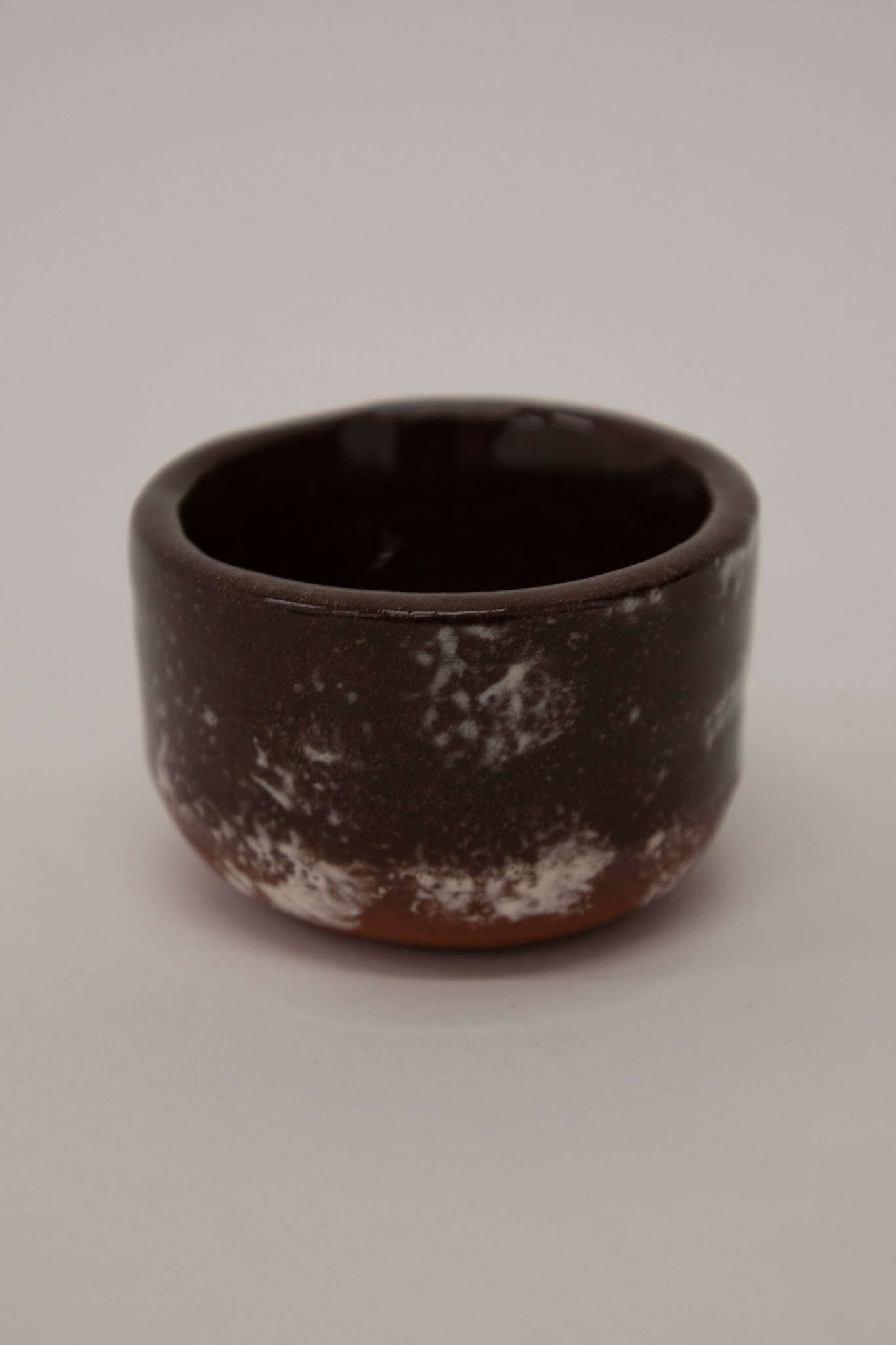 Clear shiny glaze on top of sponged on white slip from frottage