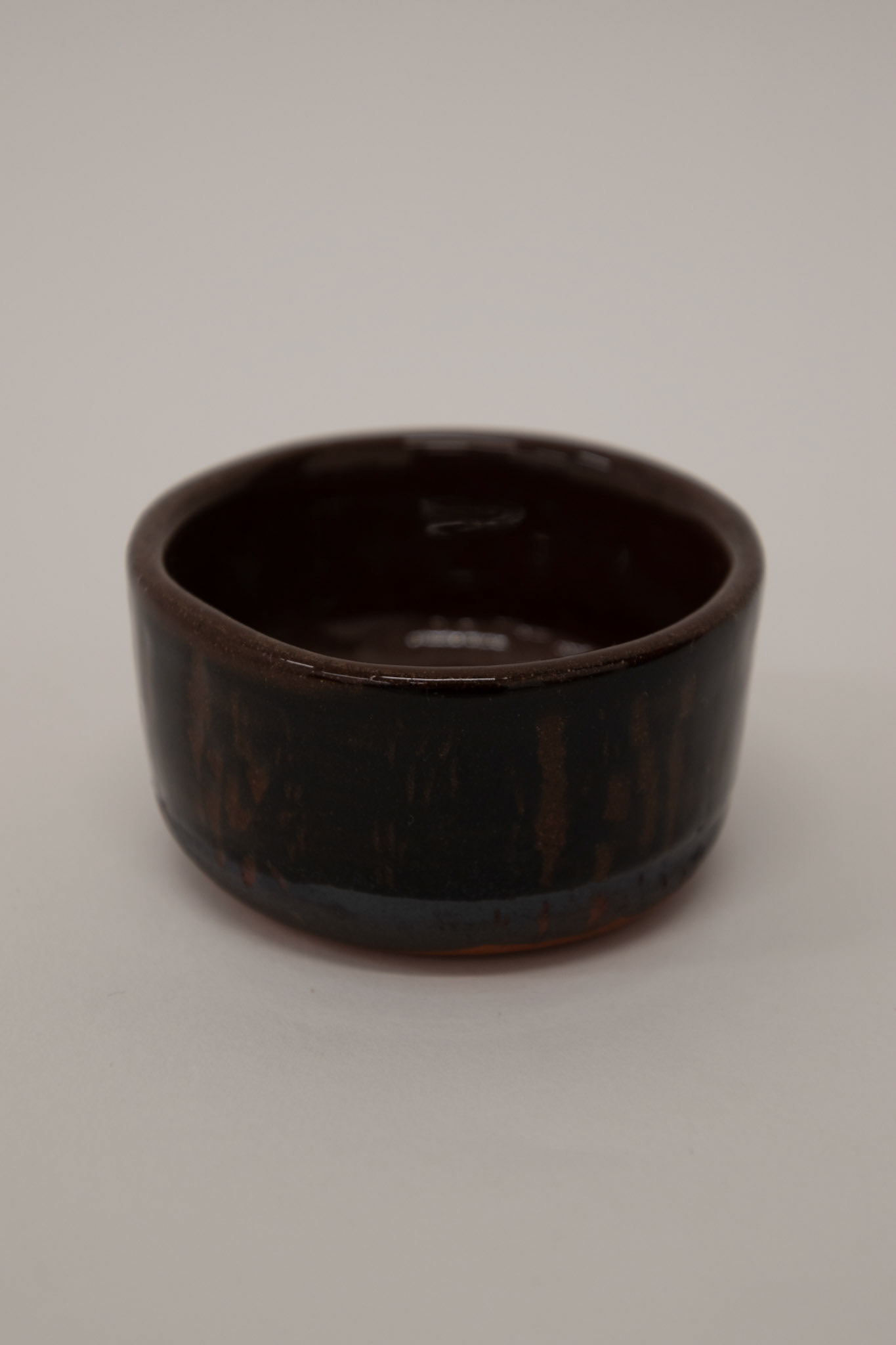 Clear shiny glaze on top of sgraffito black slip from frottage