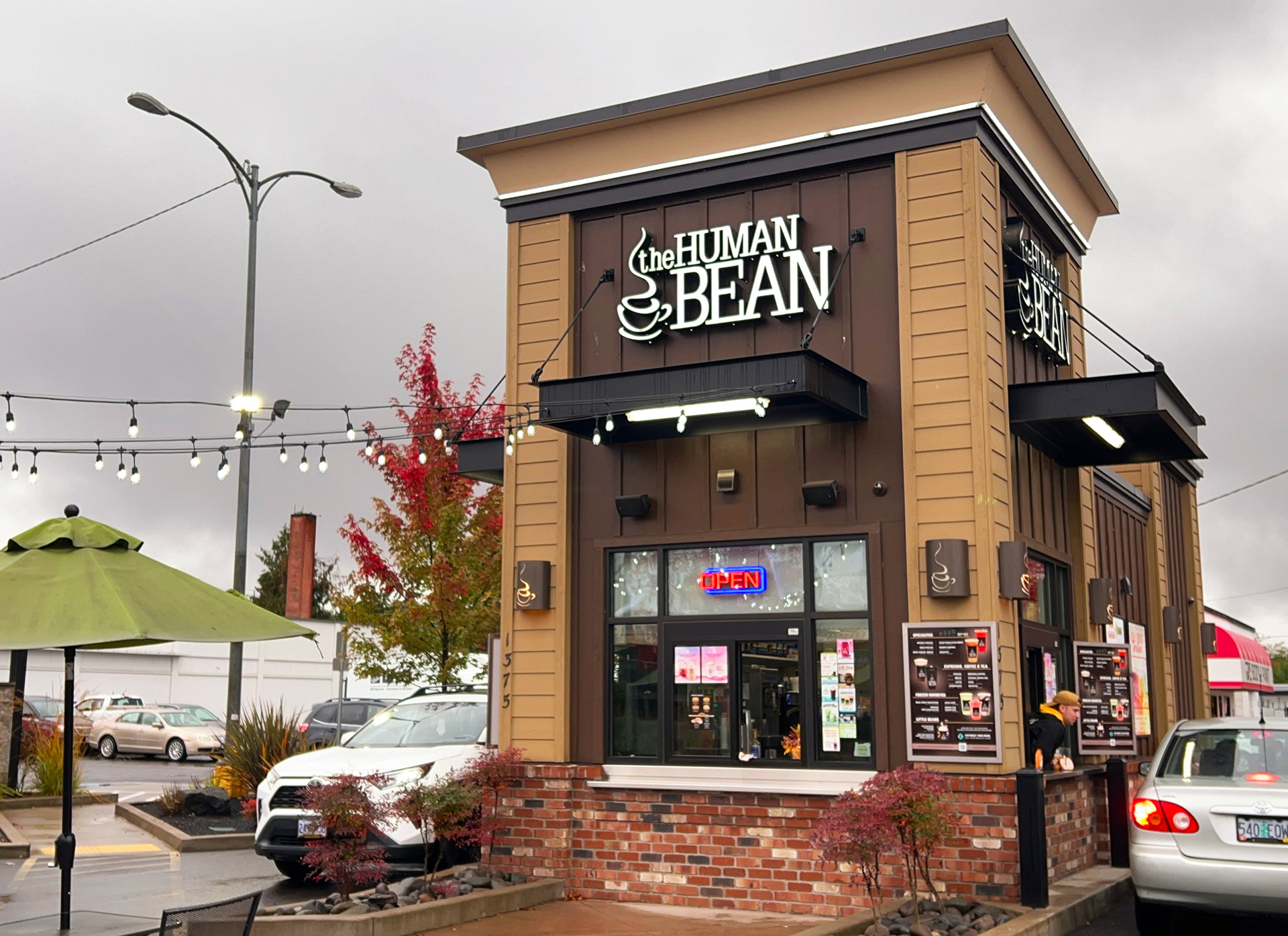 The Human Bean, a drive-thru espresso chain based in Southern Oregon faces rush hour every morning, filling coffee needs. Their dual drive-thru system allows for efficient service.